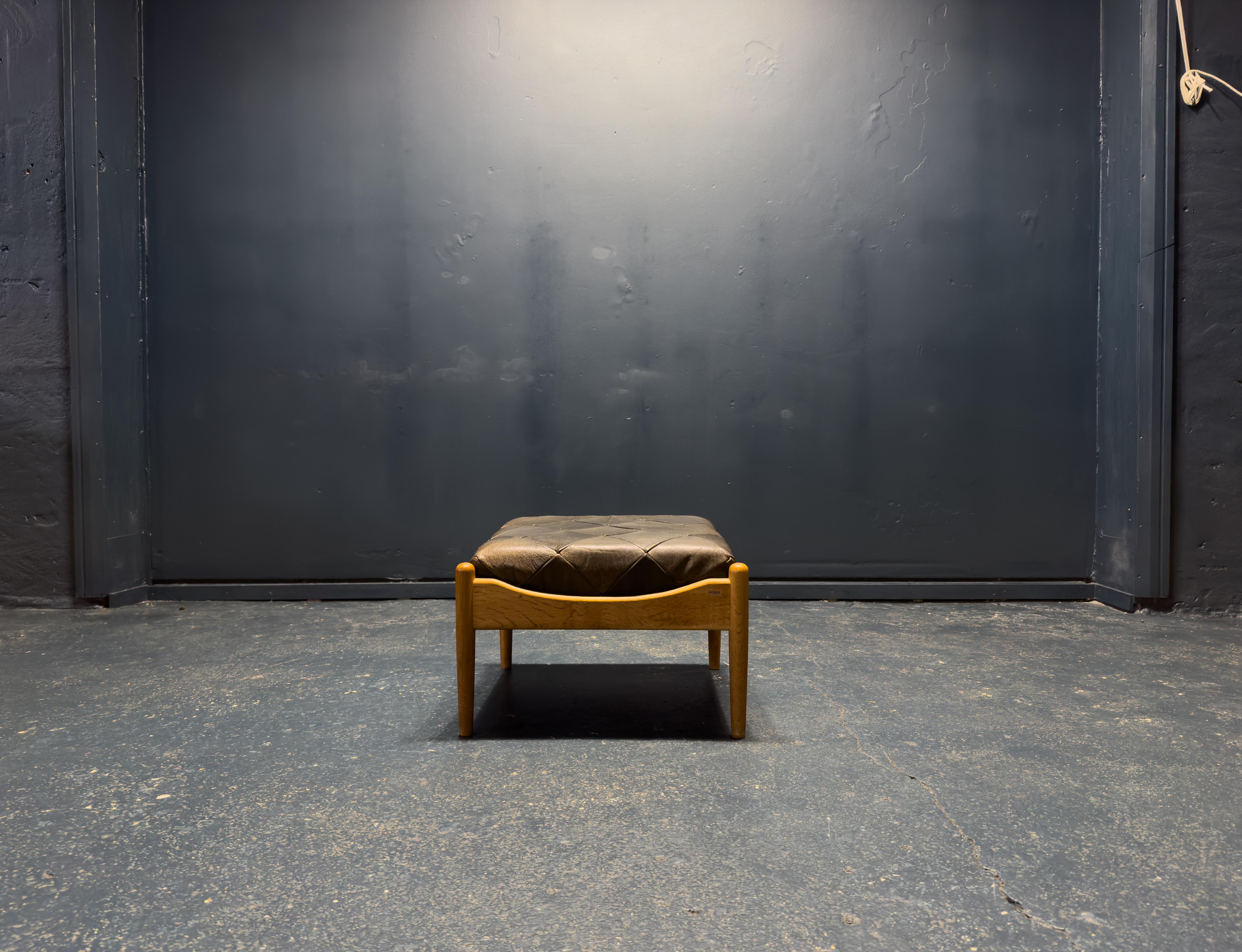 This ottoman was designed in 1963 by Kristian Vedel for Søren Willadsen Møbelfabrik. Constructed from solid oak, the frame showcases beautifully sculpted edges and rounded legs, embodying organic curves and a soft fluid shape.

The seat features