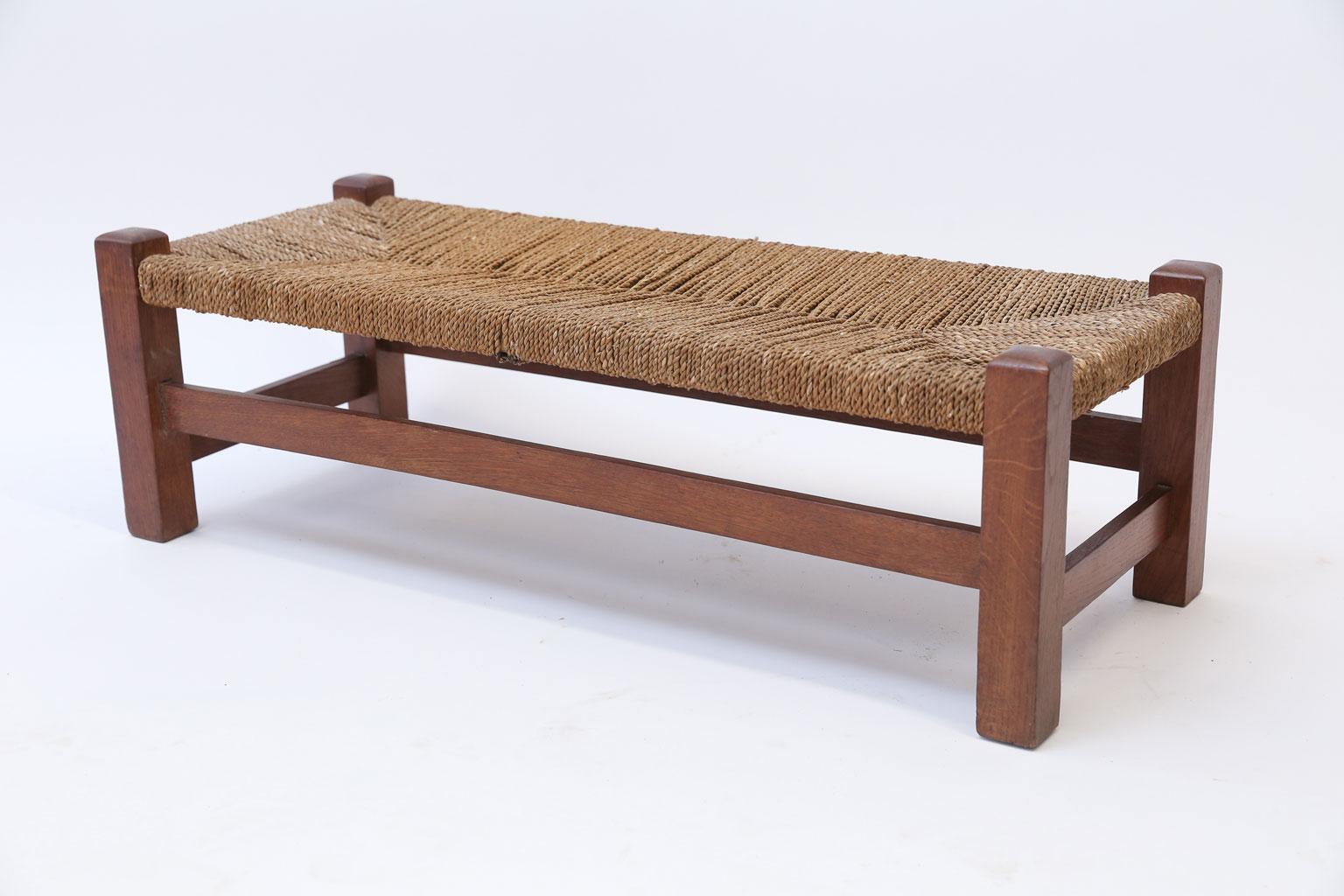 Oak and rush long stool, or double footstool, constructed circa 1910-1930 in joined construction with rush seat.