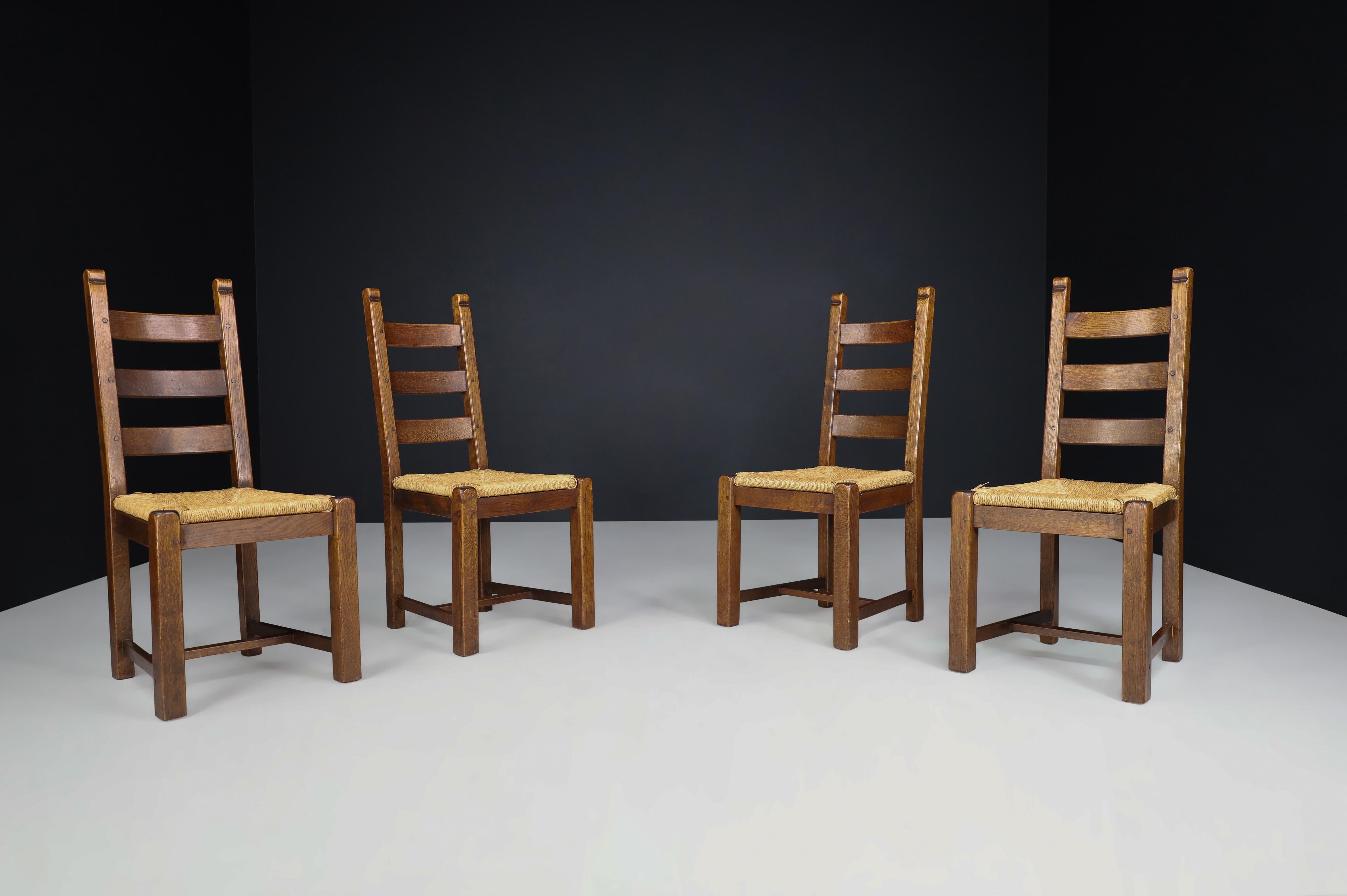 Oak and Rush Rustic Dining Chairs, France, 1960s.

These solid dining chairs made from rustic oak and rush in France during the 1960s are an absolute must-have! The set includes four chairs that are in excellent condition, boasting a warm wood