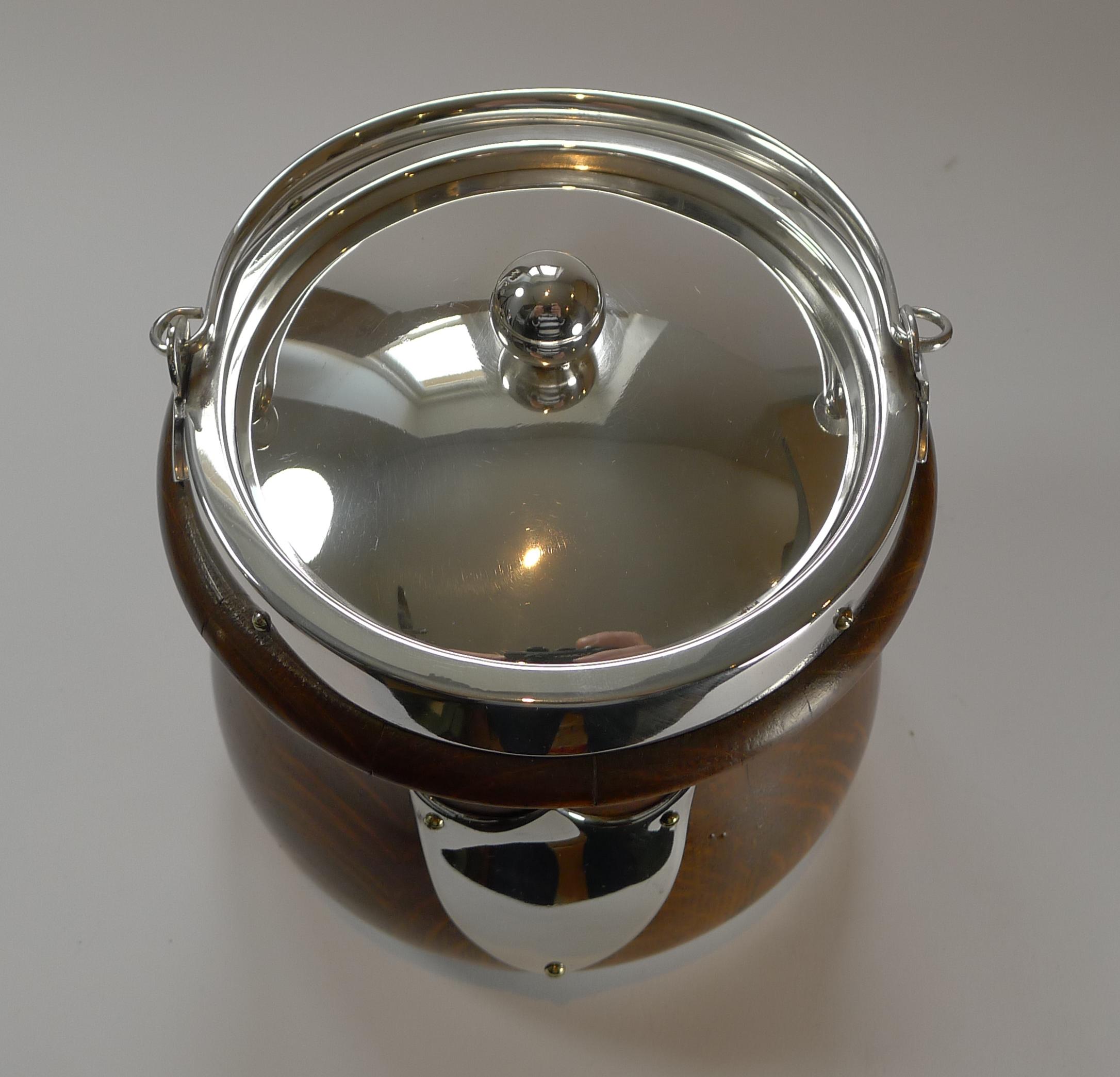 A handsome late Victorian biscuit box or barrel by the well renowned silversmith, John Grinsell & Co. of Sheffield.

The box is made from solid English oak and the fittings from silver plate and the interior retains the original ceramic liner. The