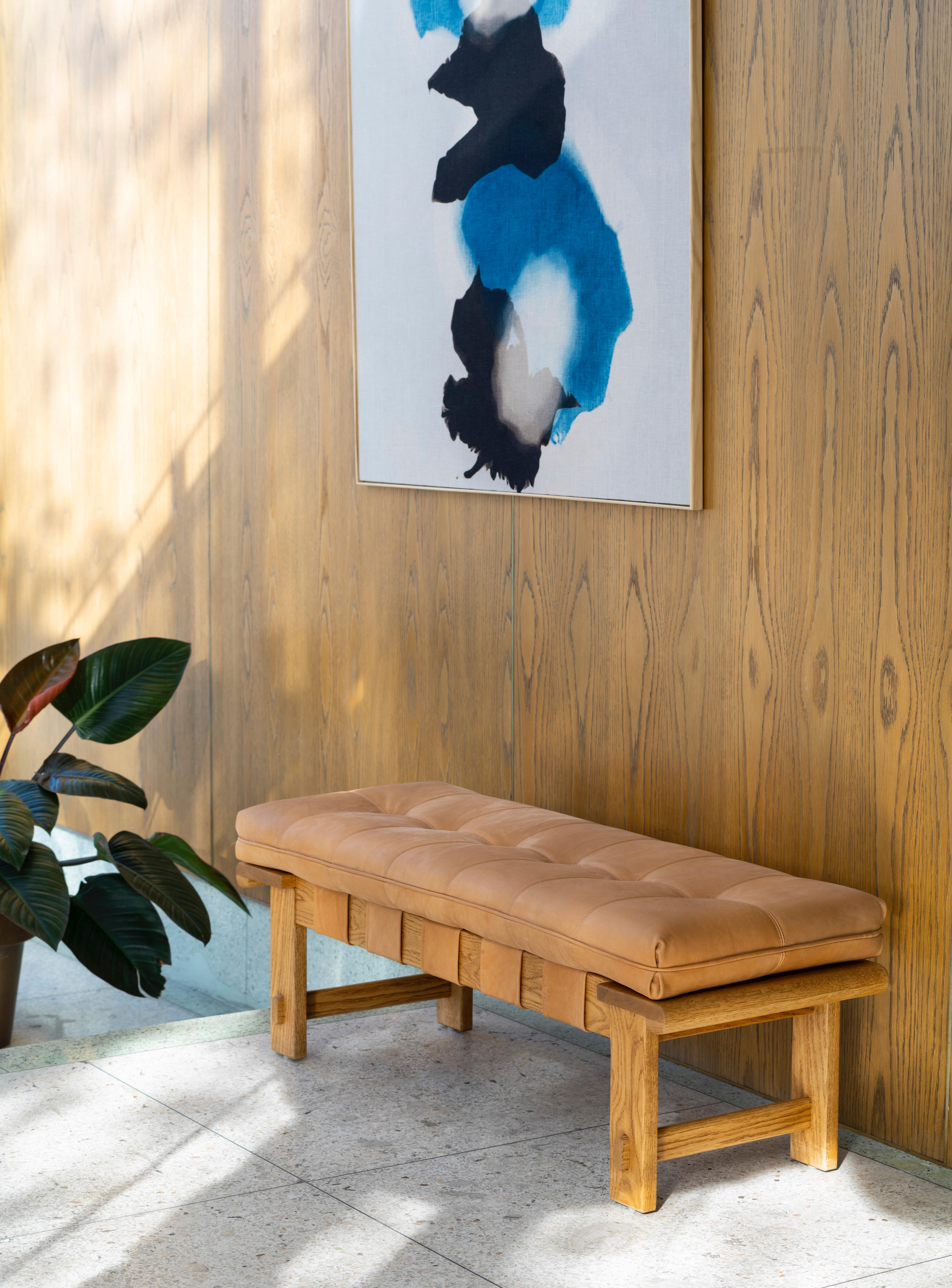 The Ojai bench features a solid white oak or solid walnut base and a tufted
leather cushion with leather straps. 


