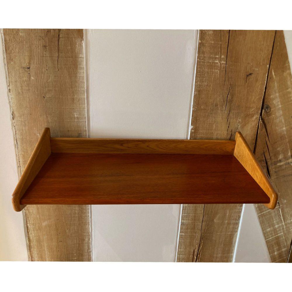 Wooden and teak shelf from the 1950s, unknown designer and manufacturer probably from Sweden because of the typical Swedish design. This shelf has a very simple design with a very simple hanging system. It is still elegant and functional.
