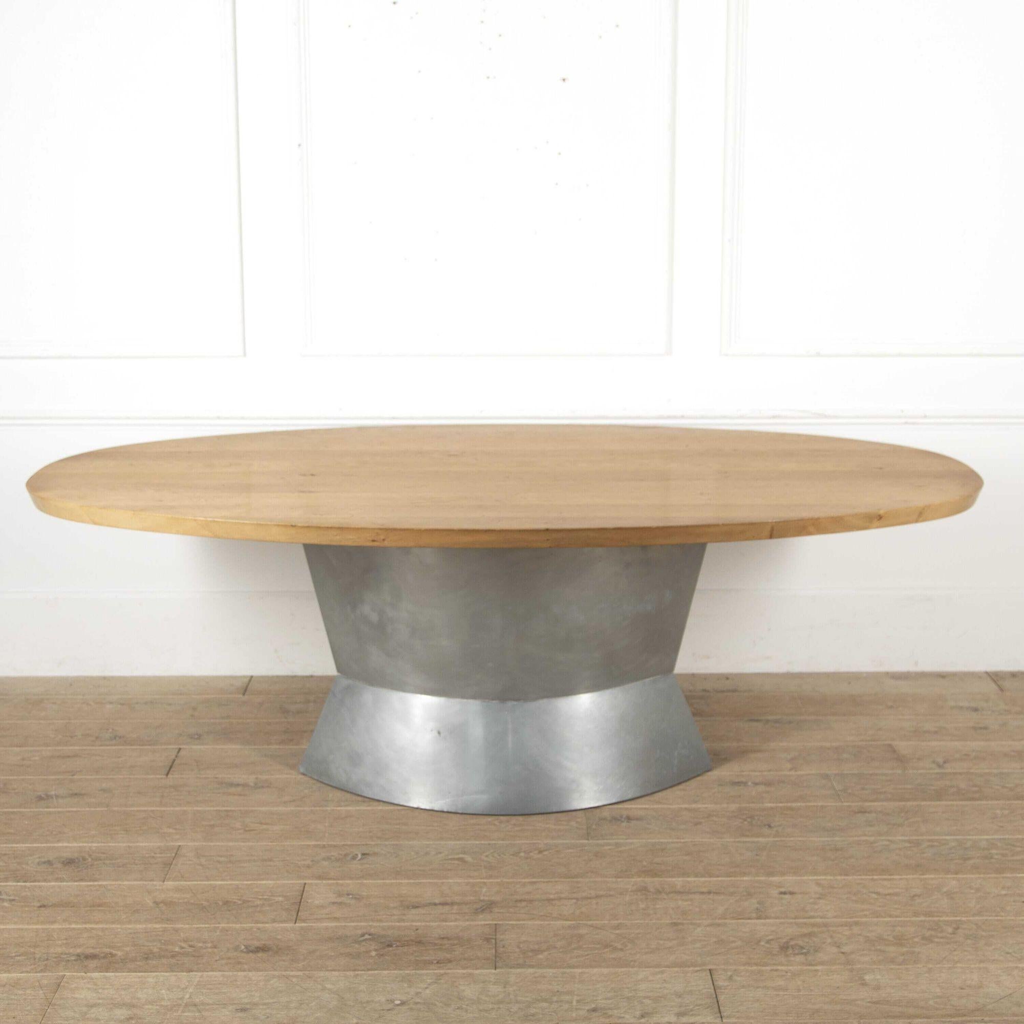 Impressive 20th Century dining table. 
This fantastic piece is impressive because of its design and size. The body is made from zinc which is topped with a fabulous oak oval top. 
It has a nautical theme throughout, which highlights its imposing