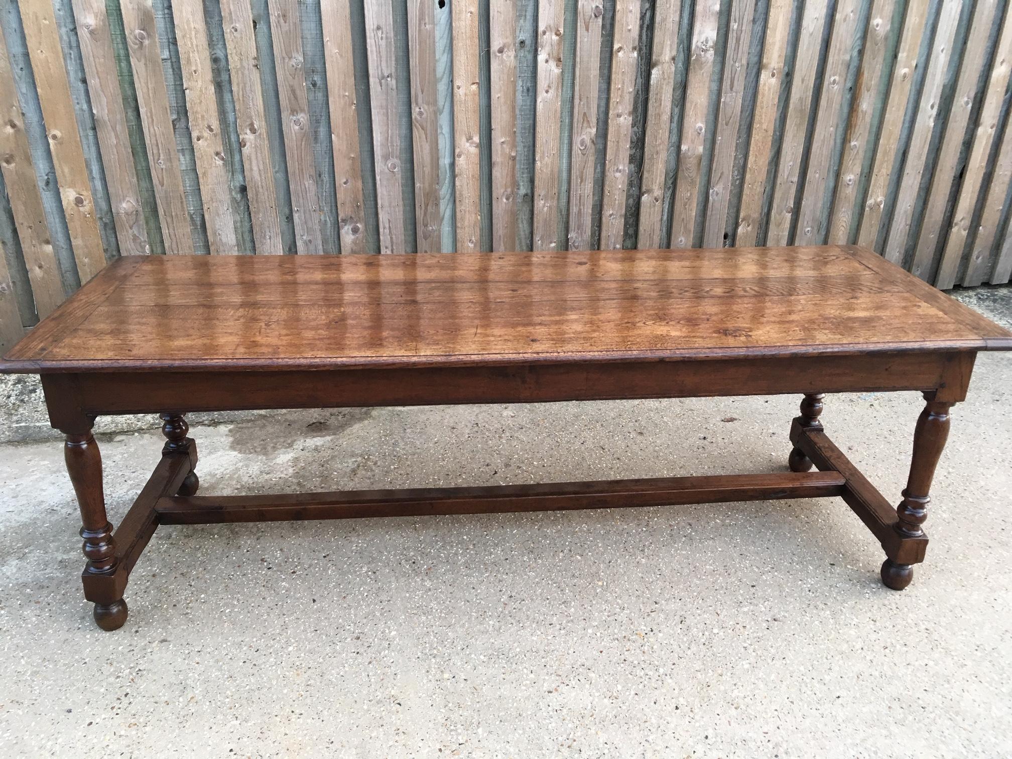 Oak antique dining table with two drawers stands on sturdy centre stretcher. Table has a lovely three plank top with good cleated ends.
     