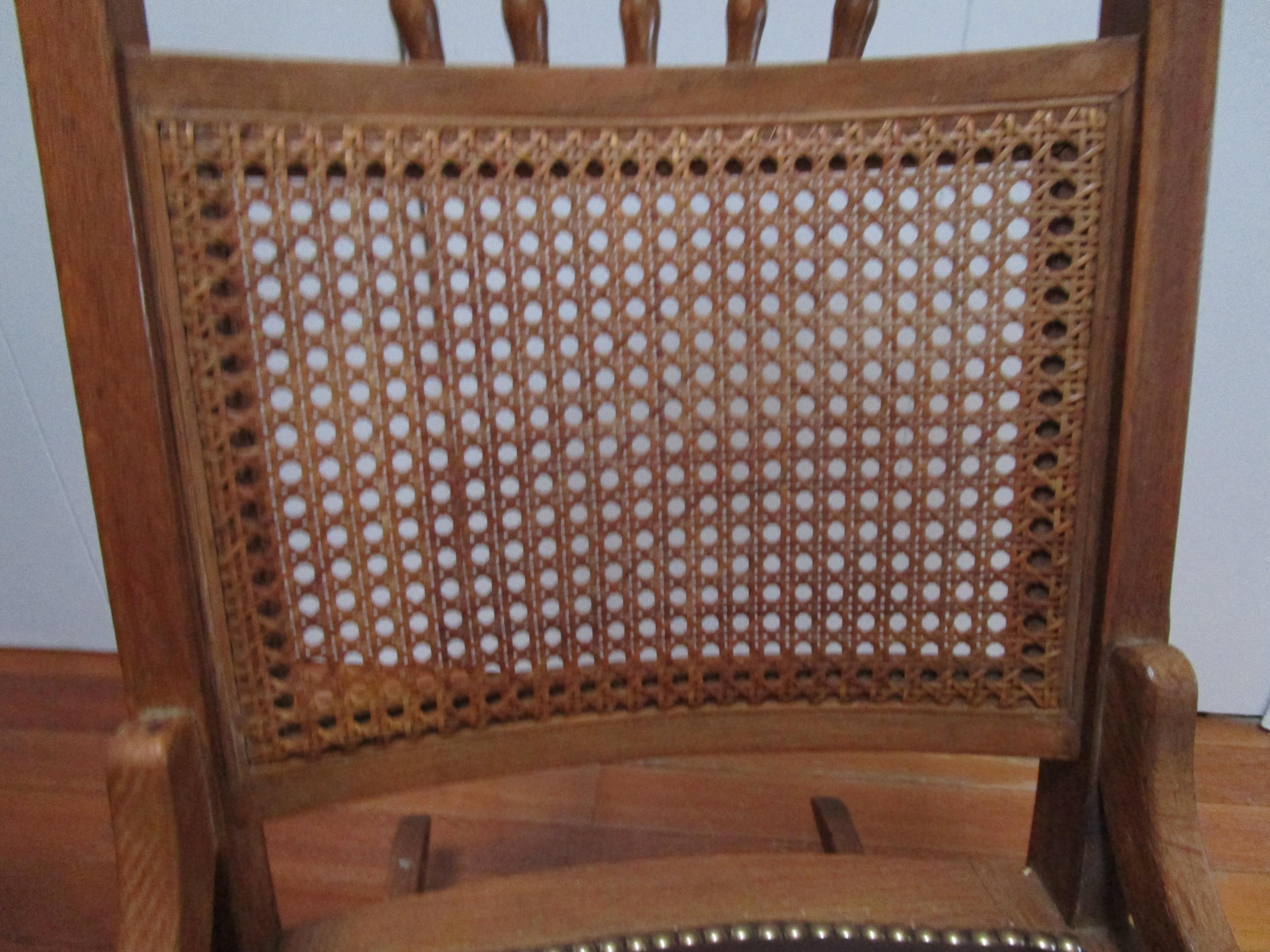Hammered Oak Antique Rocking Chair with Clavos and Leather Seat and Cane Back For Sale