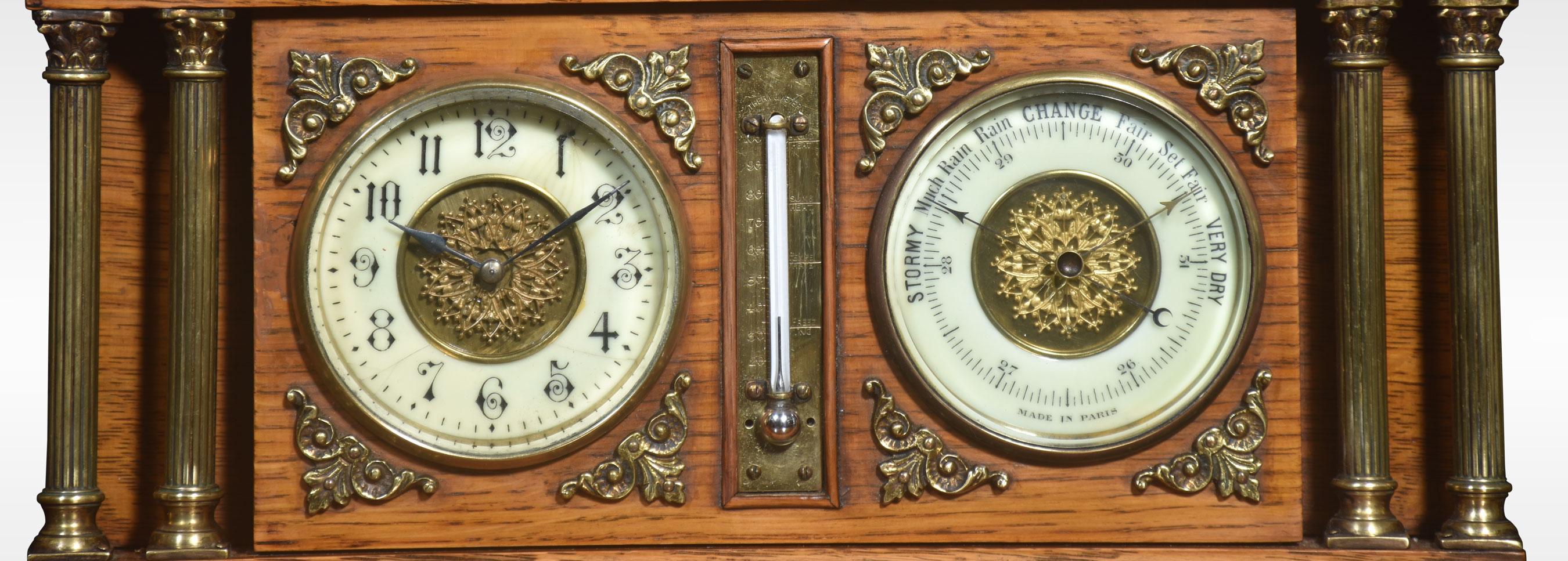 Oak architectural desk clock and barometer, of temple form with ceramic dials, centred with a thermometer and within double Corinthian brass columns. All raised up on a stepped base.
Dimensions
Height 10 Inches
Width 17 Inches
Depth 4 Inches