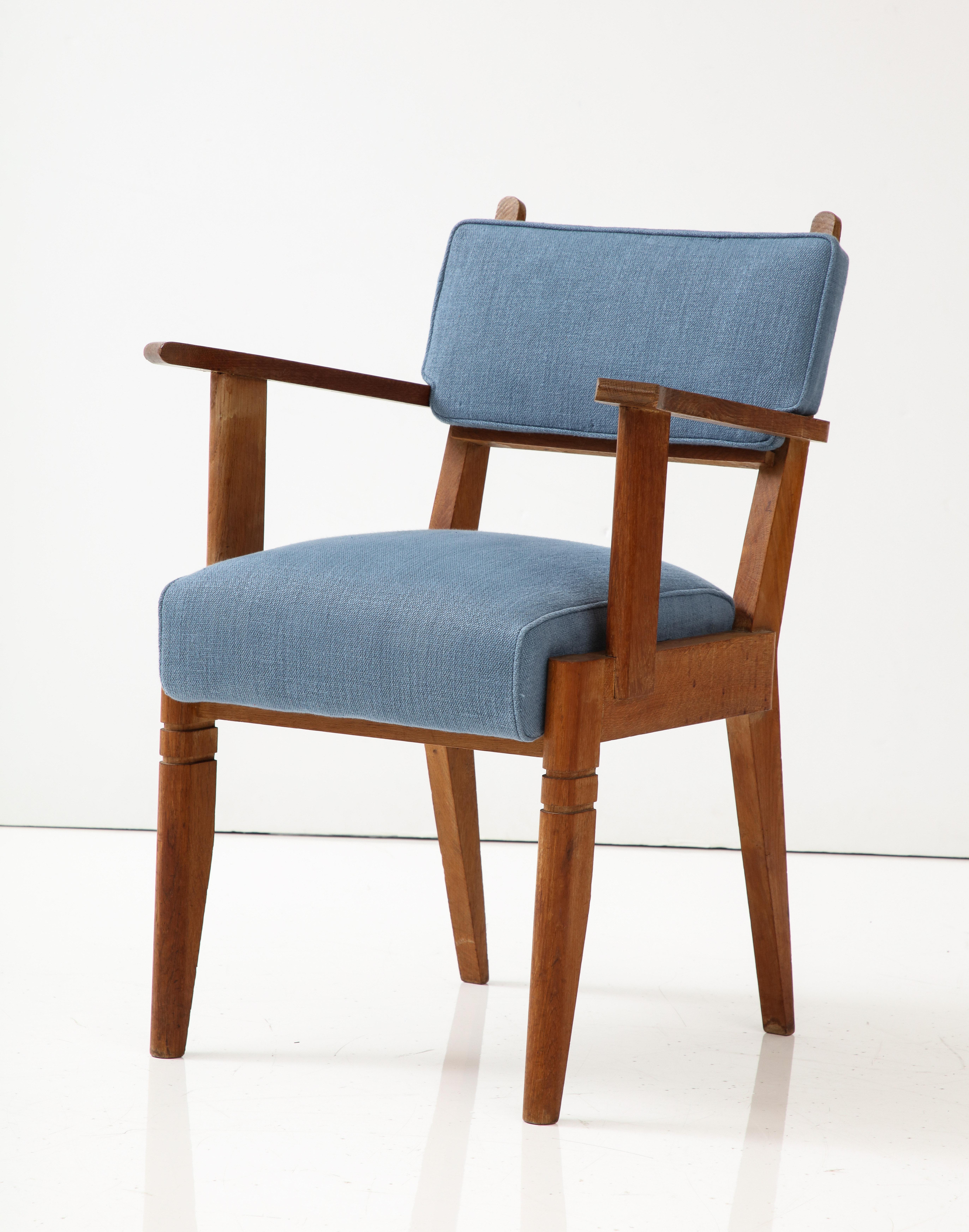 Two other chairs are available, upholstered in a rust red linen fabric.

Smart, tall chair with comfortable upholstery and elegant lines. New cushions with blue linen upholstery.