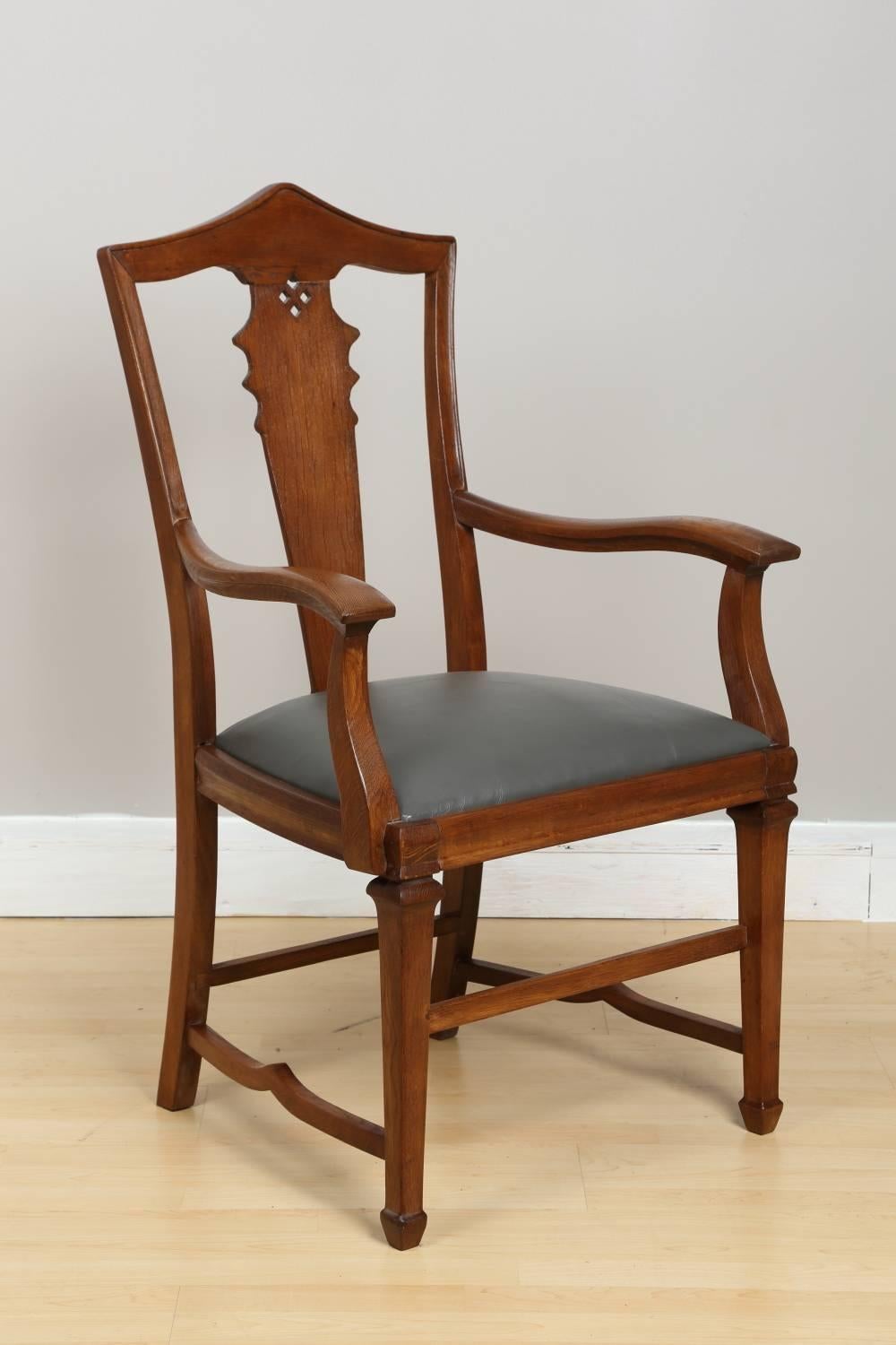 Oak armchair, circa 1910. This tall chair originated in Germany, it has been restored, reupholstered, and finished with semi gloss lacquer. Complimentary delivery and set up within 100 mile radius from Chicago, IL. Measures: Seat height 19
