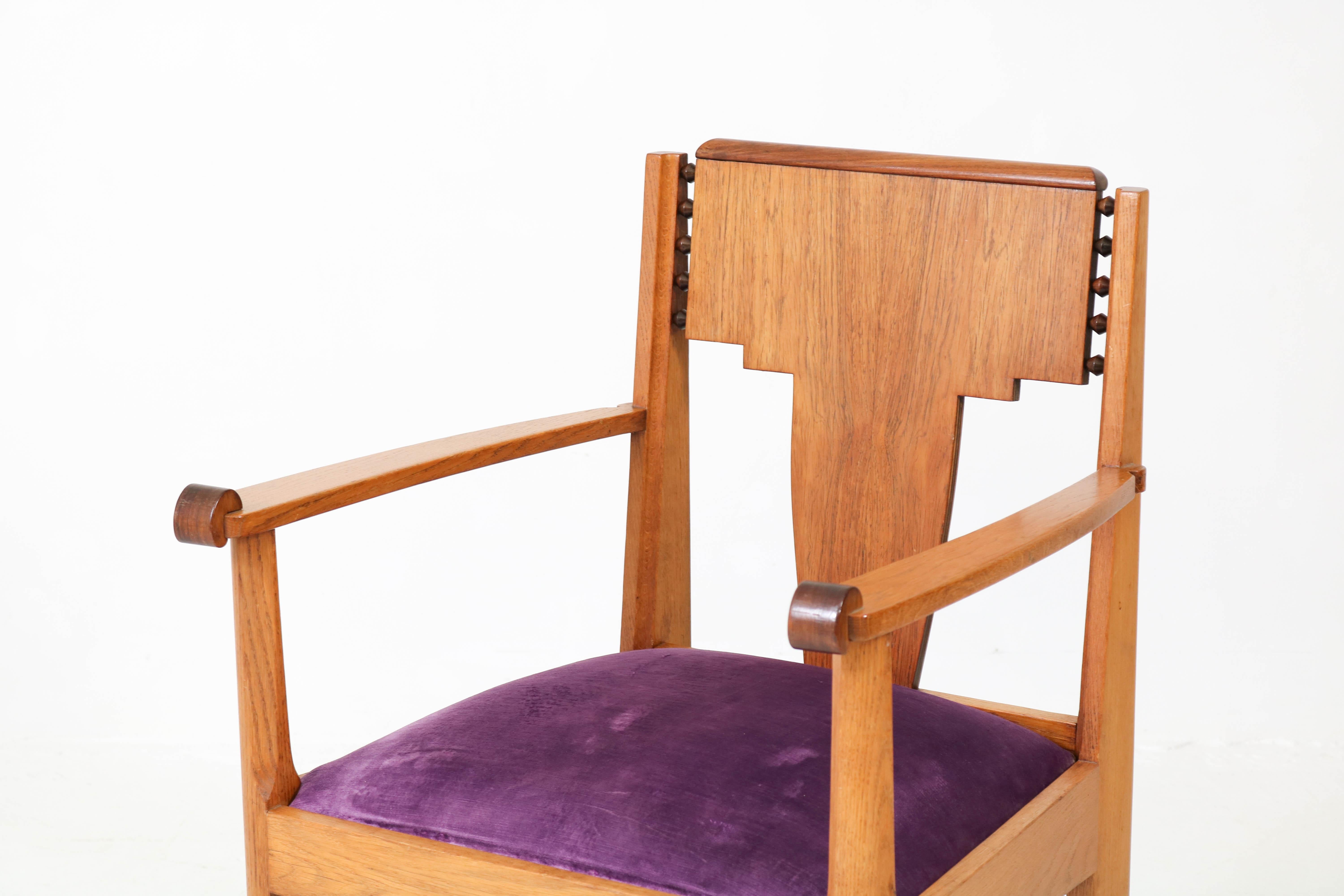 Elegant Art Deco Amsterdam School armchair by J.J. Zijfers Amsterdam.
Striking Dutch design from the 1920s.
Solid oak with re-upholstered purple fabric.
In good original condition with minor wear consistent with age and use,
preserving a