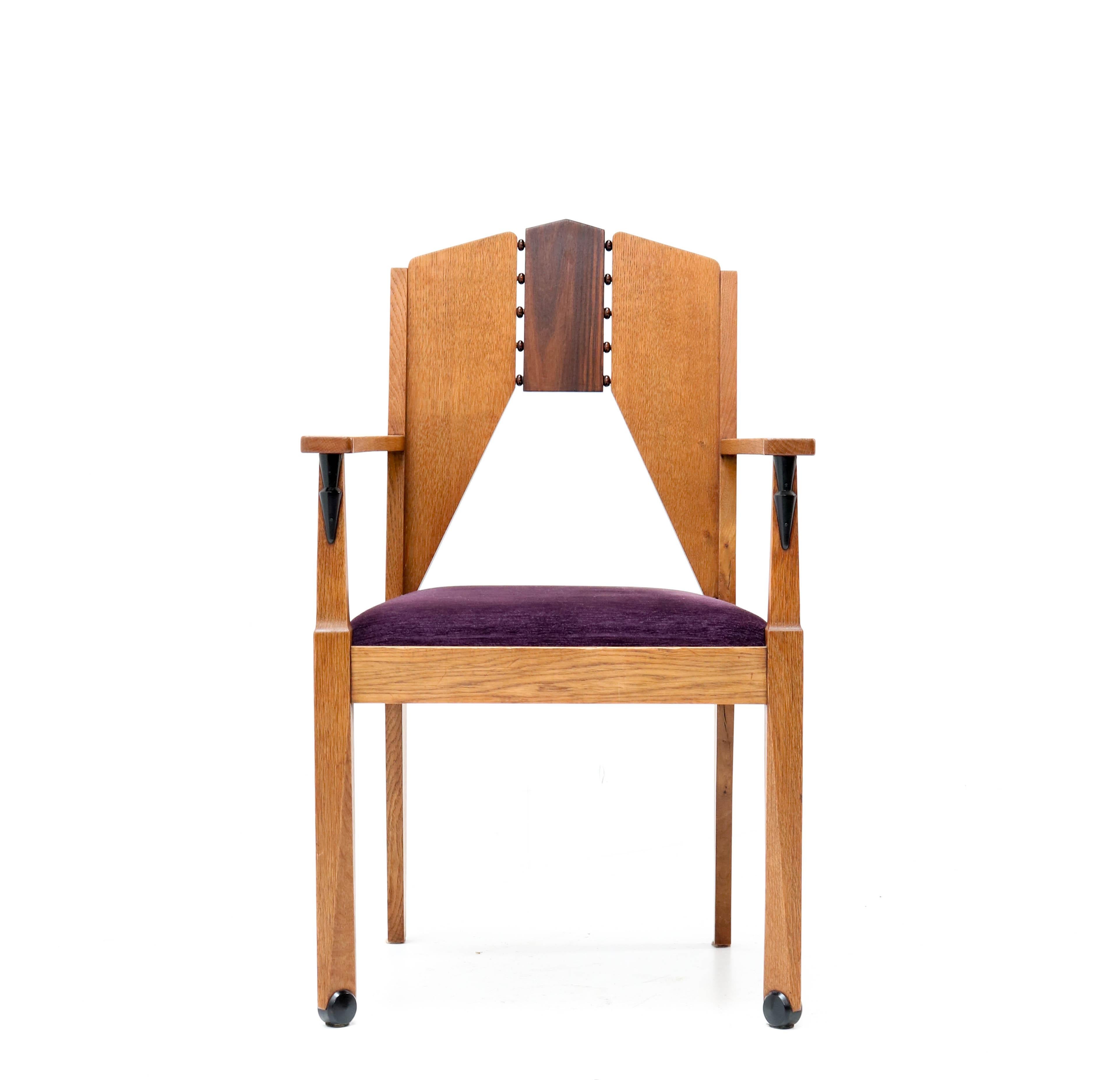 Stunning Art Deco Amsterdam School armchair.
Design by J.J. Zijfers Amsterdam.
Striking Dutch design from the 1920s.
Solid oak with solid macassar ebony and macassar ebony veneer.
Re-upholstered with purple velvet fabric.
In very good condition