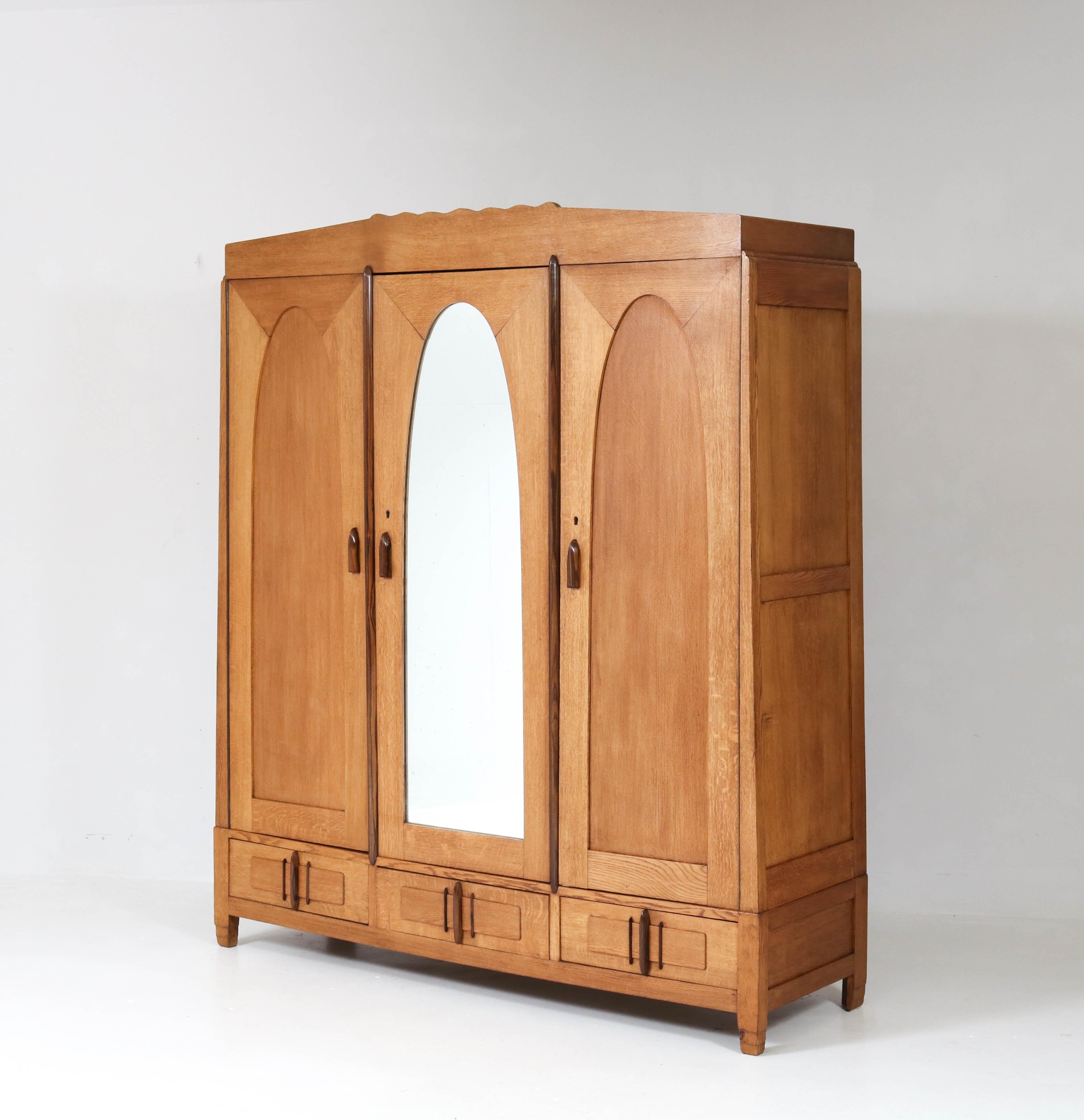 Offered by Amsterdam Modernism:
Stunning and rare Art Deco Amsterdam School armoir or wardrobe by J.J. Zijfers.
Striking Dutch design in oak from the 1920s.
Original Macassar ebony handles on doors and drawers.
This wonderful piece of furniture can