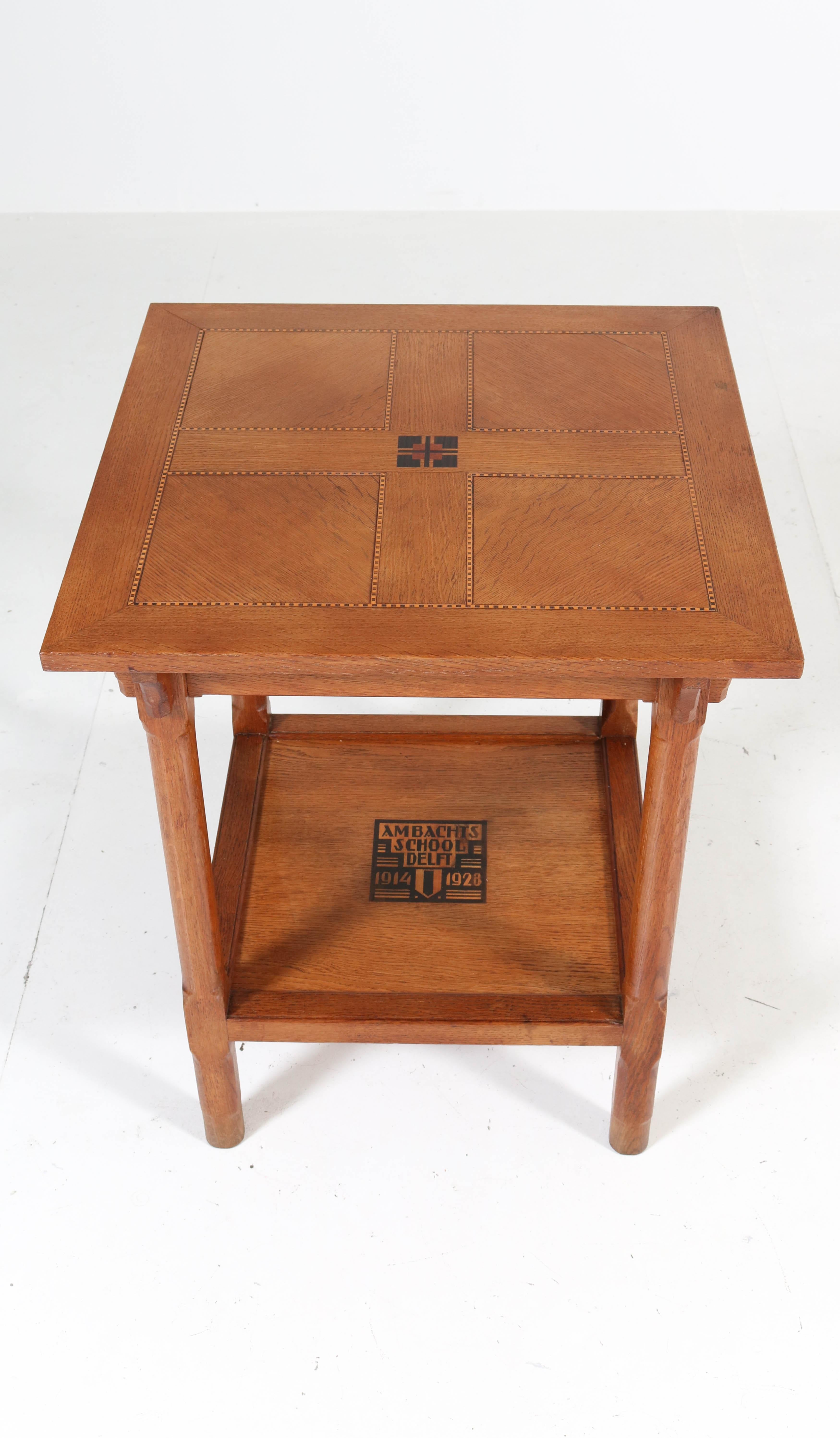 Stunning and rare Art Deco Amsterdam School coffee table.
This table has been executed by pupils of the Ambachts School delft in 1928.
Solid oak with inlay and description Ambachts School delft 1914-1928.
In very good original condition with