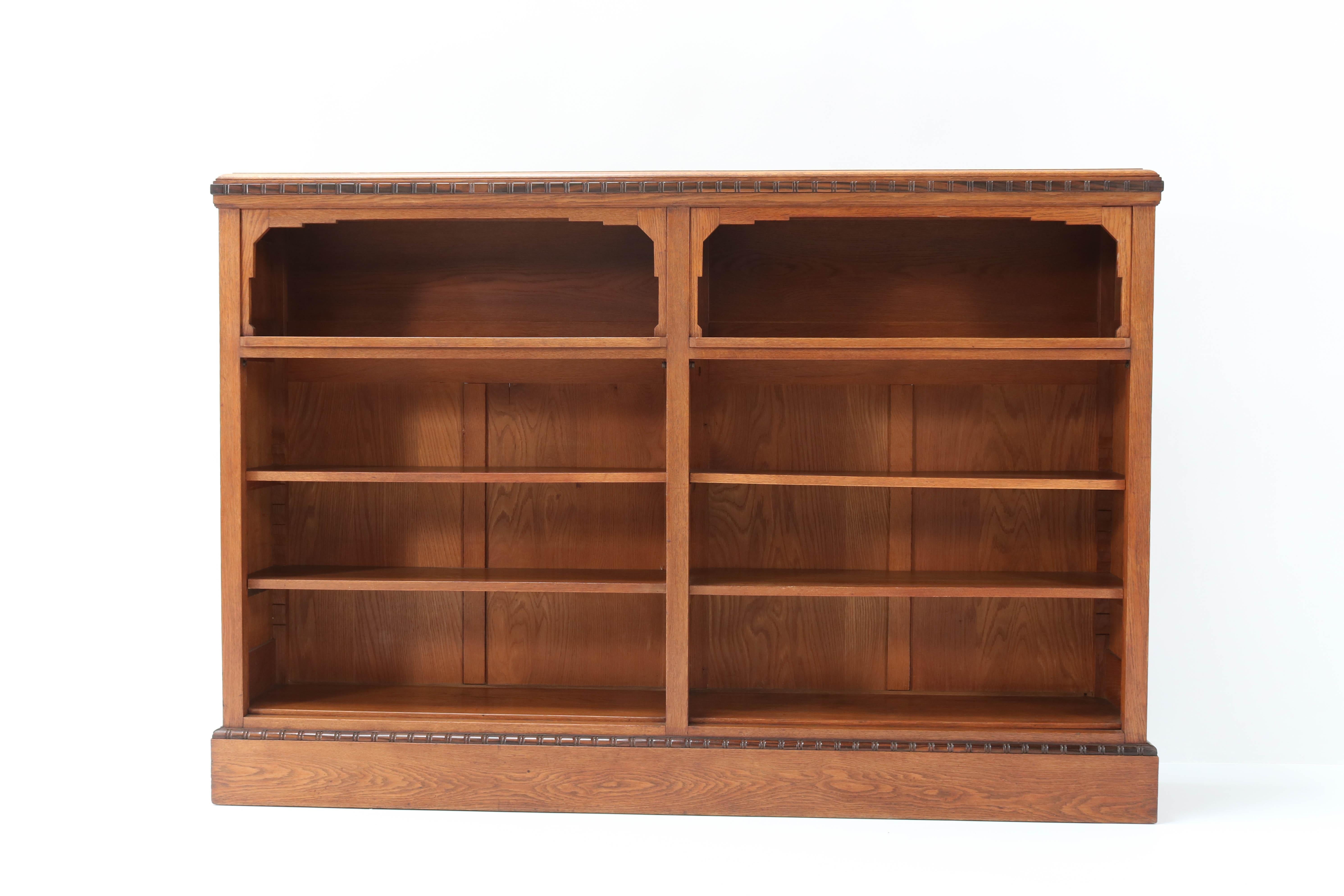 Magnificent and rare Art Deco Amsterdam School open bookcase.
Striking Dutch design from the 1920s.
Solid oak with original solid ebony Macassar lining.
Four original solid oak shelves,adjustable in height.
The craftsmanship of this wonderful