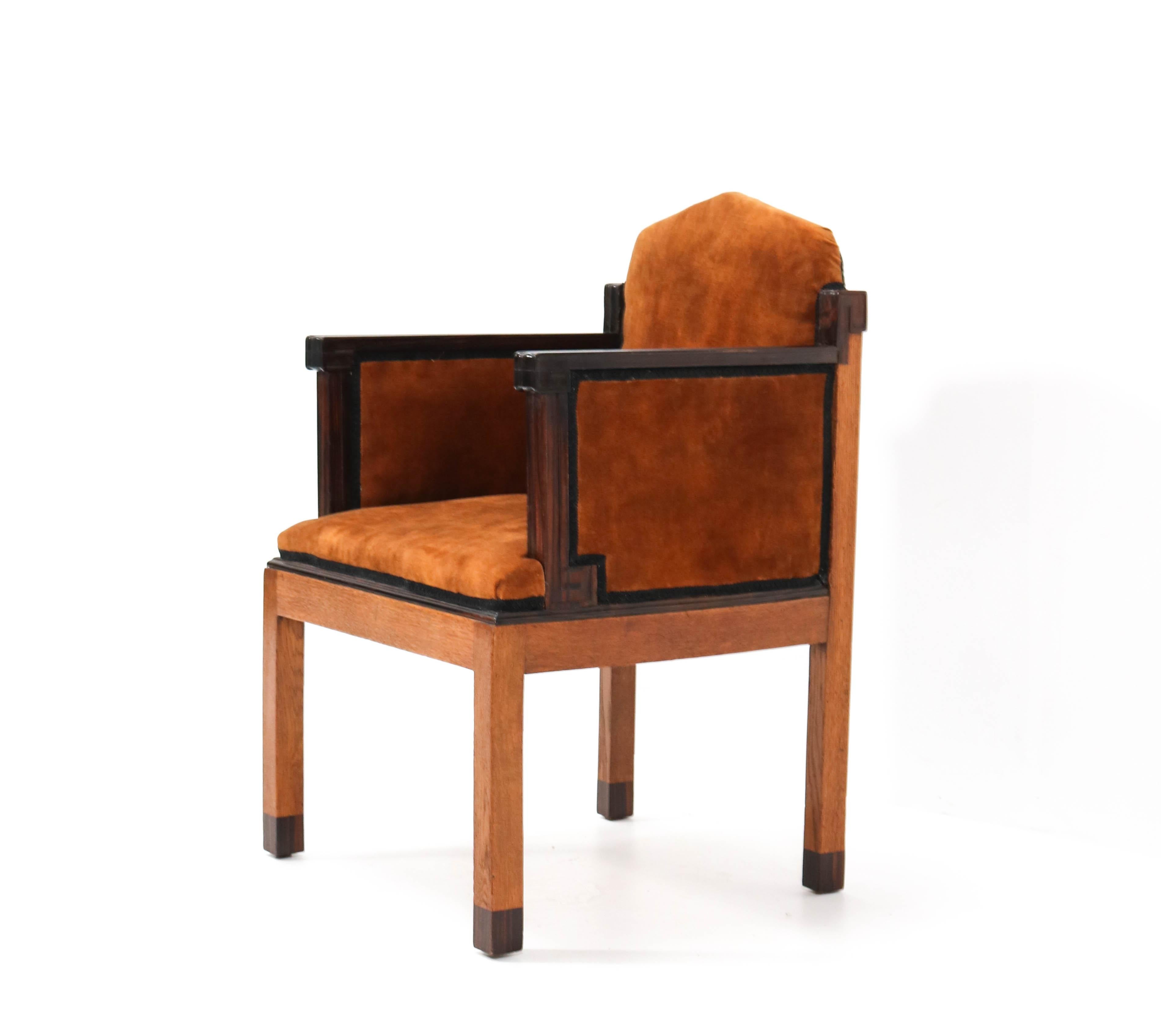 Stunning and very rare Art Deco Amsterdamse School armchair.
Design by Fa. Drilling Amsterdam.
Striking Dutch design from the 1920s.
Solid oak with solid macassar ebony armrests.
Re-upholstered with velvet fabric.
In good original condition