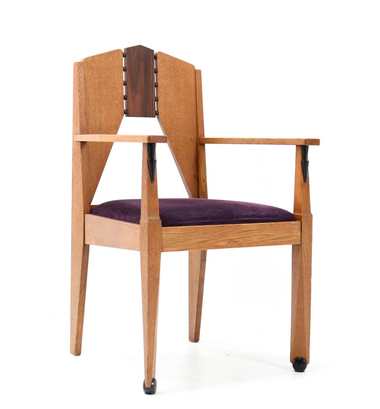 Stunning Art Deco Amsterdamse school armchair.
Design by J.J. Zijfers Amsterdam.
Striking Dutch design from the 1920s.
Solid oak with solid macassar ebony and macassar ebony veneer.
Re-upholstered with purple velvet fabric.
In very good