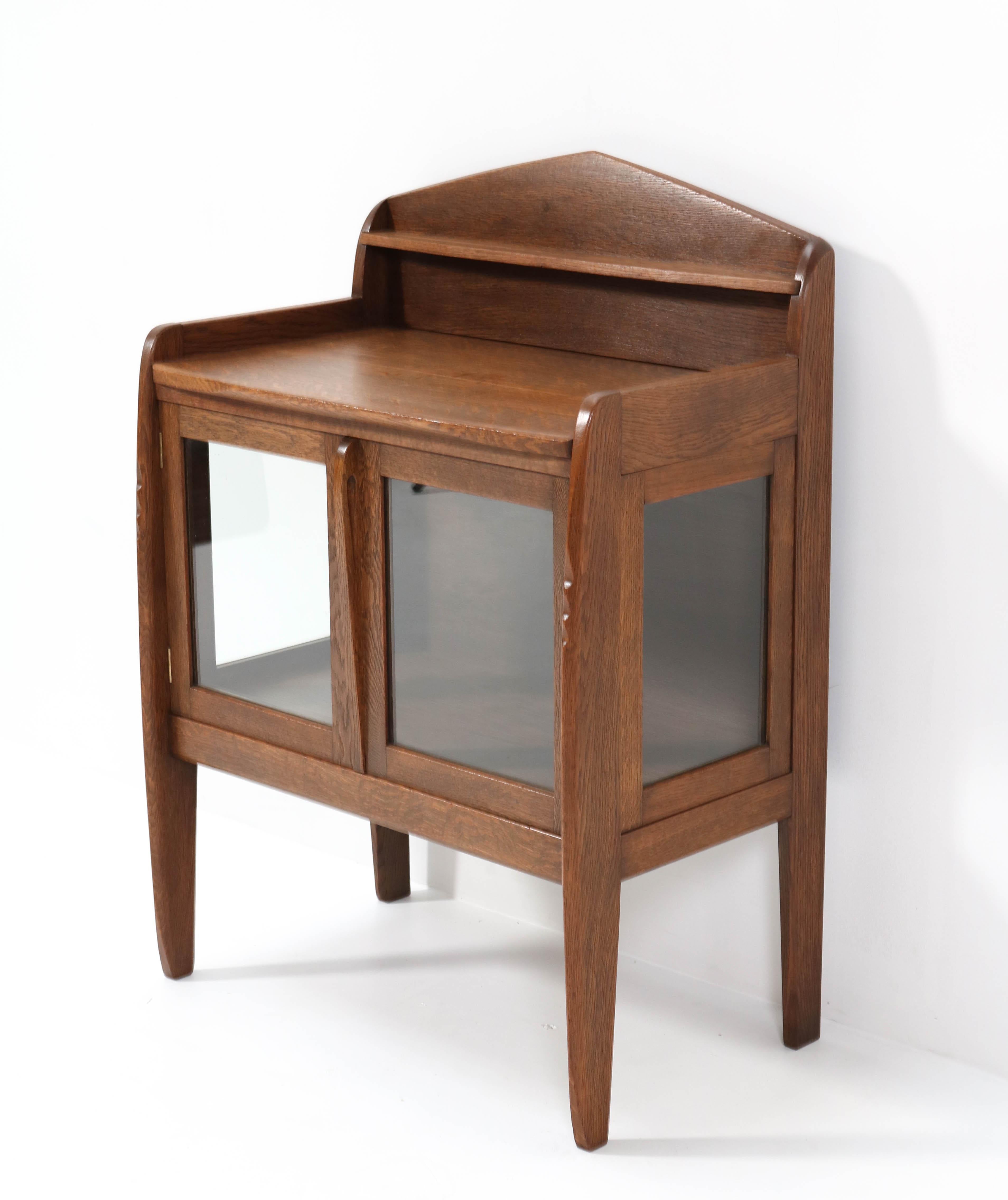 Stunning and rare Art Deco Amsterdamse School tea cabinet.
Design attributed to A.F. van der Wey.
Striking Dutch design from the 1920s.
Solid oak with hand-carved details.
In very good condition with a beautiful patina.