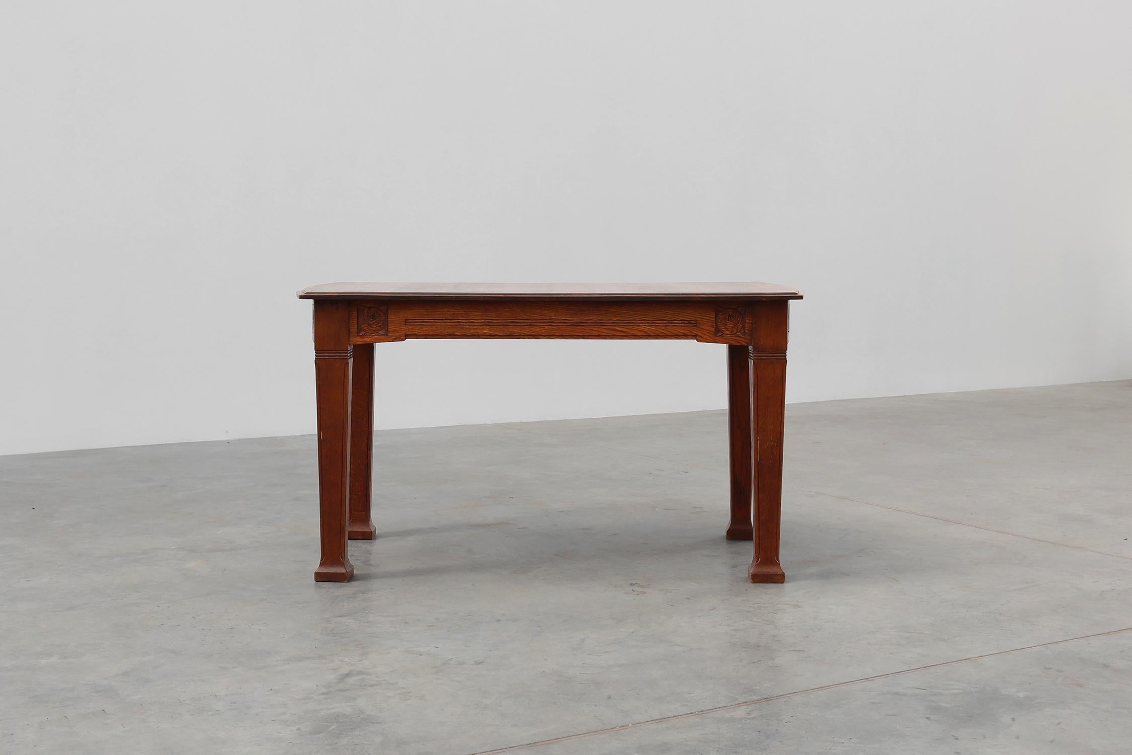 Hand-Carved Oak Art Deco dining table with carved frieze, France 1920s For Sale