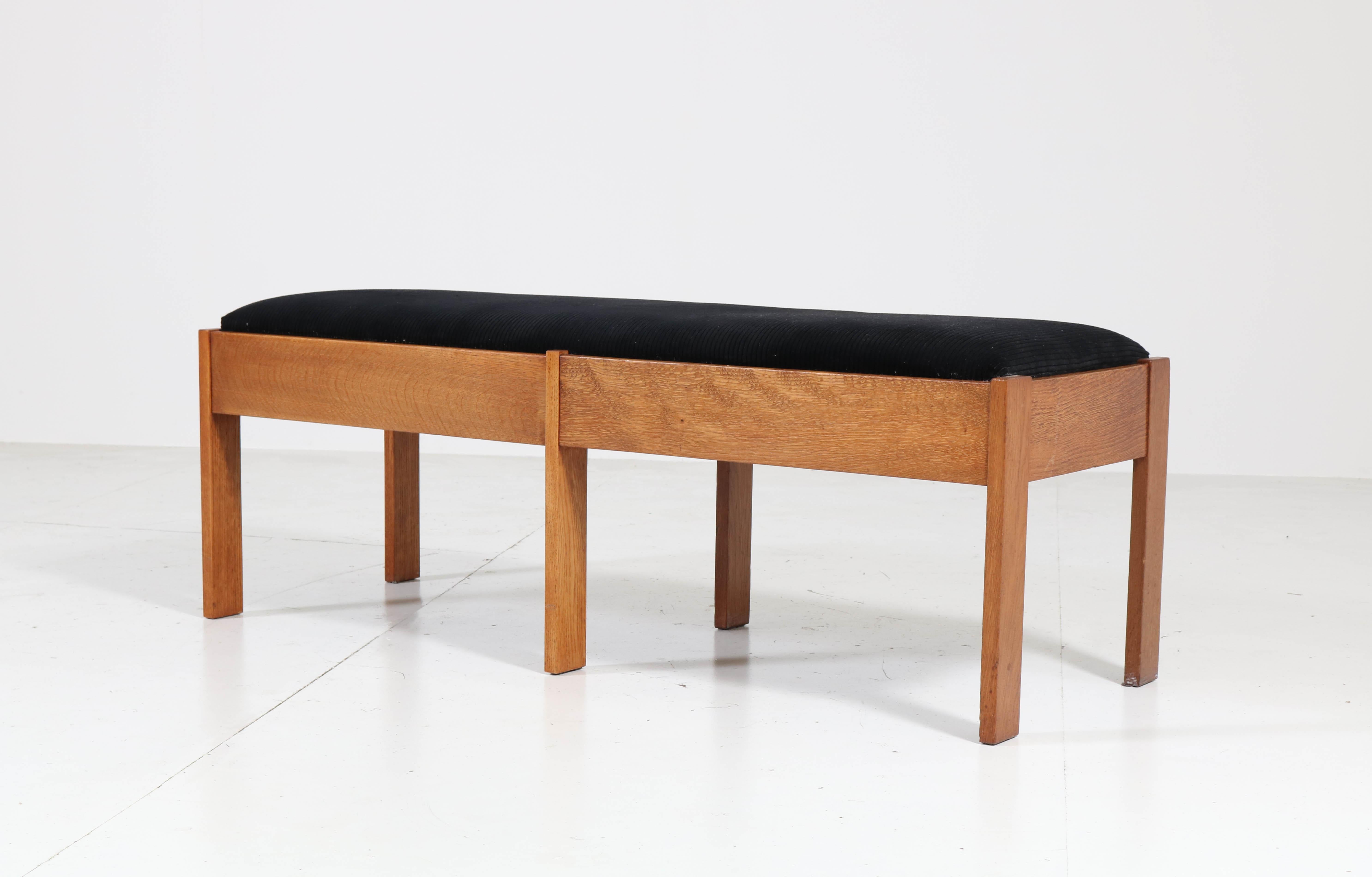 Magnificent and very rare Art Deco Haagse School bench or sofa.
Design by J.C. Jansen for L.O.V. Oosterbeek.
Striking Dutch design from the twenties.
Solid oak and re-upholstered seat with black Manchester corduroy fabric.
Marked with original