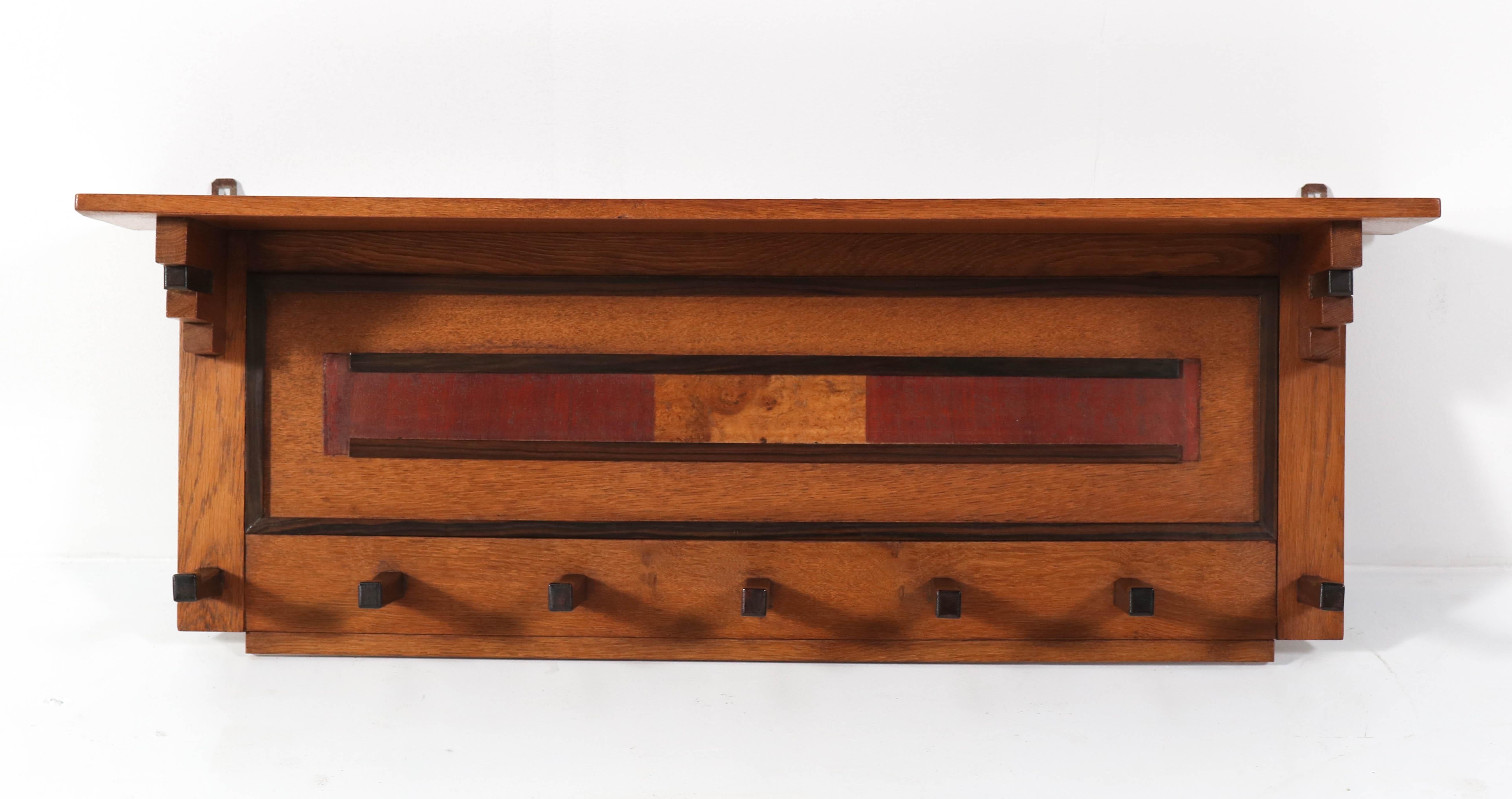 Stunning Art Deco Haagse School coat rack.
Design by P.E.L. Izeren for Genneper Molen.
Striking Dutch design from the twenties.
Solid oak with solid Macassar ebony hooks and inlay.
In very good condition with minor wear consistent with age and