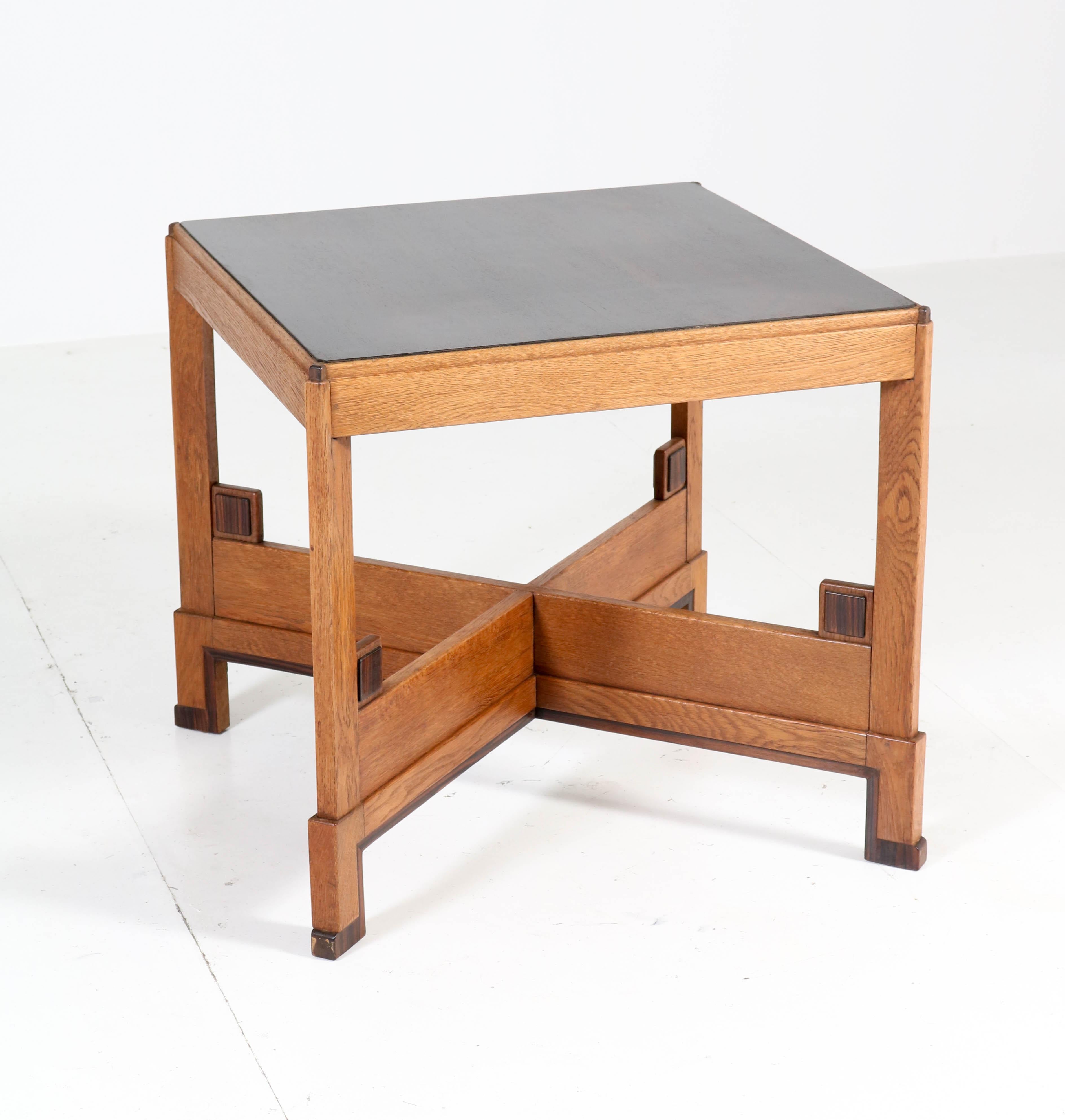 Wonderful and rare Art Deco Haagse School coffee table.
Striking Dutch design from the 1920s.
Solid oak base with ebony Macassar veneered top.
In very good condition with minor wear consistent with age and use,
preserving a beautiful patina.
   