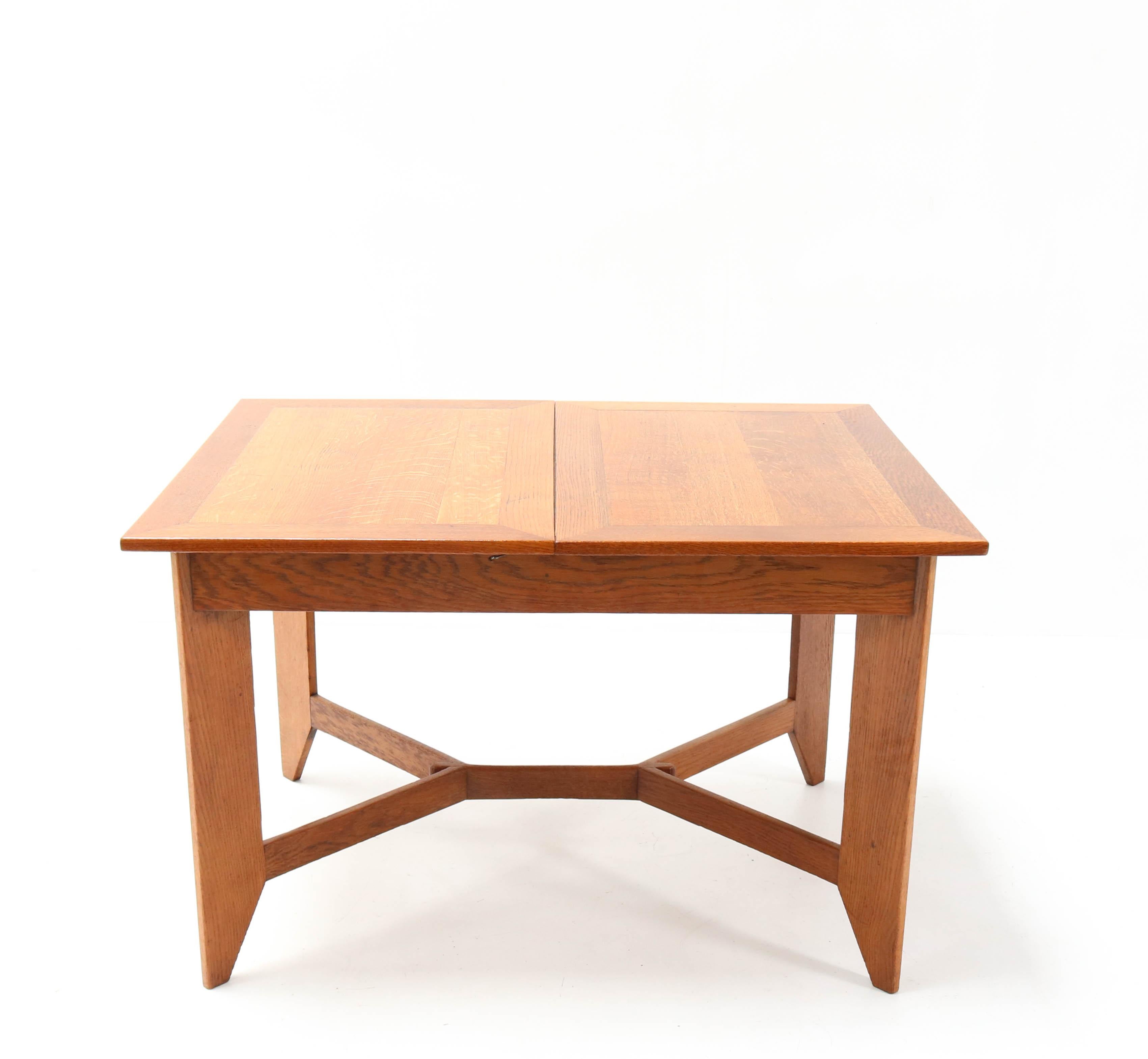 Wonderful Art Deco Haagse School dining table.
Design by Hendrik Wouda for H. Pander & Zonen Den Haag.
Striking Dutch design from the 1920s.
Solid oak with one original extension.
Measurement of the extension: 44.5 cm or 17.52 in. Measurement in