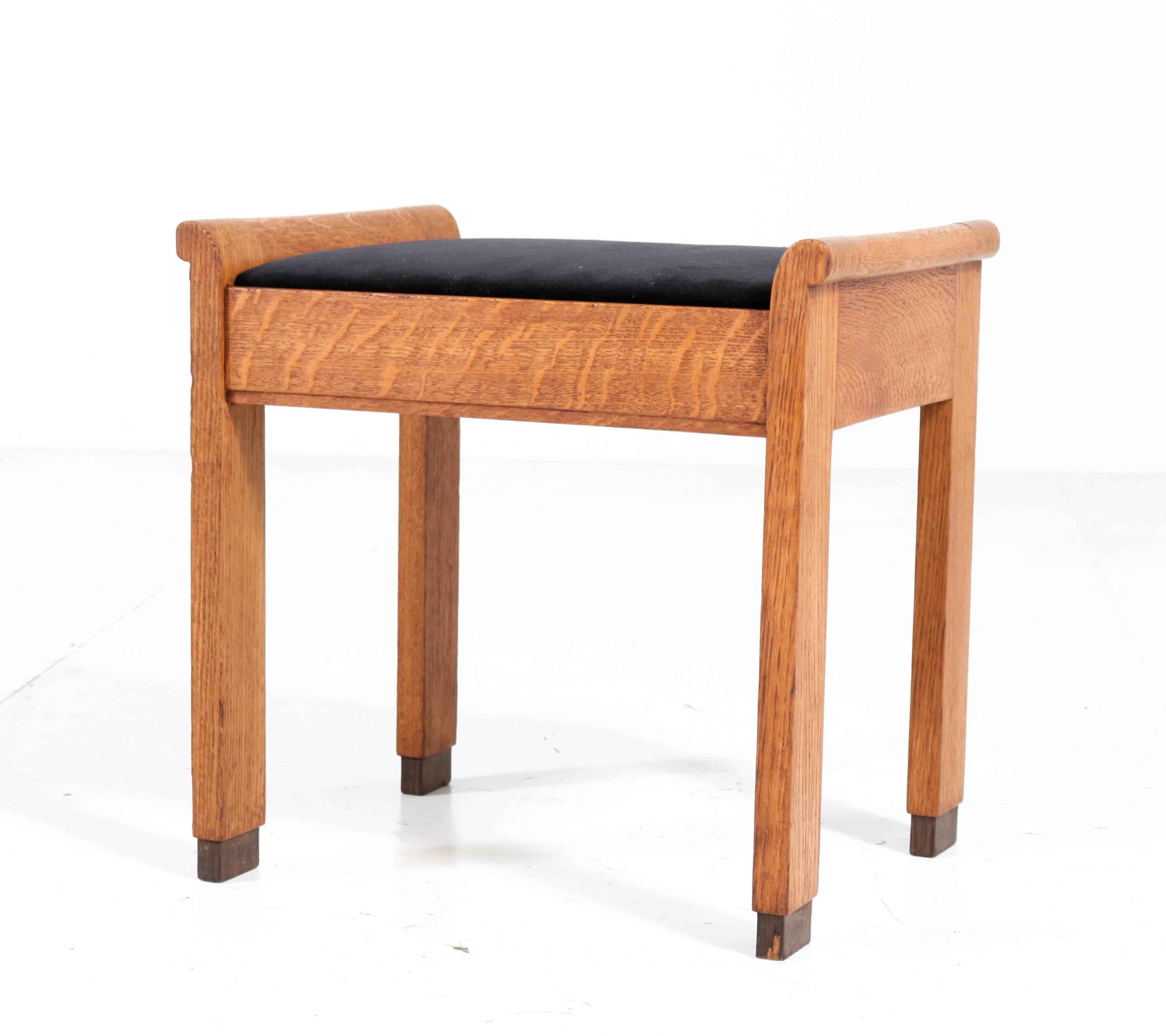 Stunning Art Deco Haagse School stool.
Design by J.A. Muntendam for L.O.V. Oosterbeek.
Striking Dutch design from the 1920s.
Solid oak frame with re-upholstered black Manchester corduroy fabric.
In very good condition with minor wear consistent