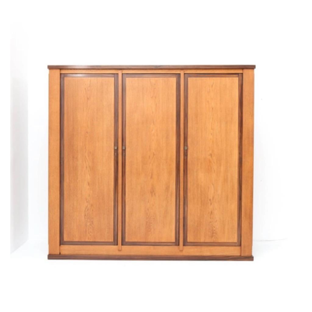 Magnificent and ultra rare Art Deco Haagse School armoire or wardrobe.
Design by Hendrik Wouda for H. Pander & Zonen.
Striking Dutch design from the 1920s.
Solid oak and oak veneer with solid Macassar ebony and Macassar ebony veneer.
Three