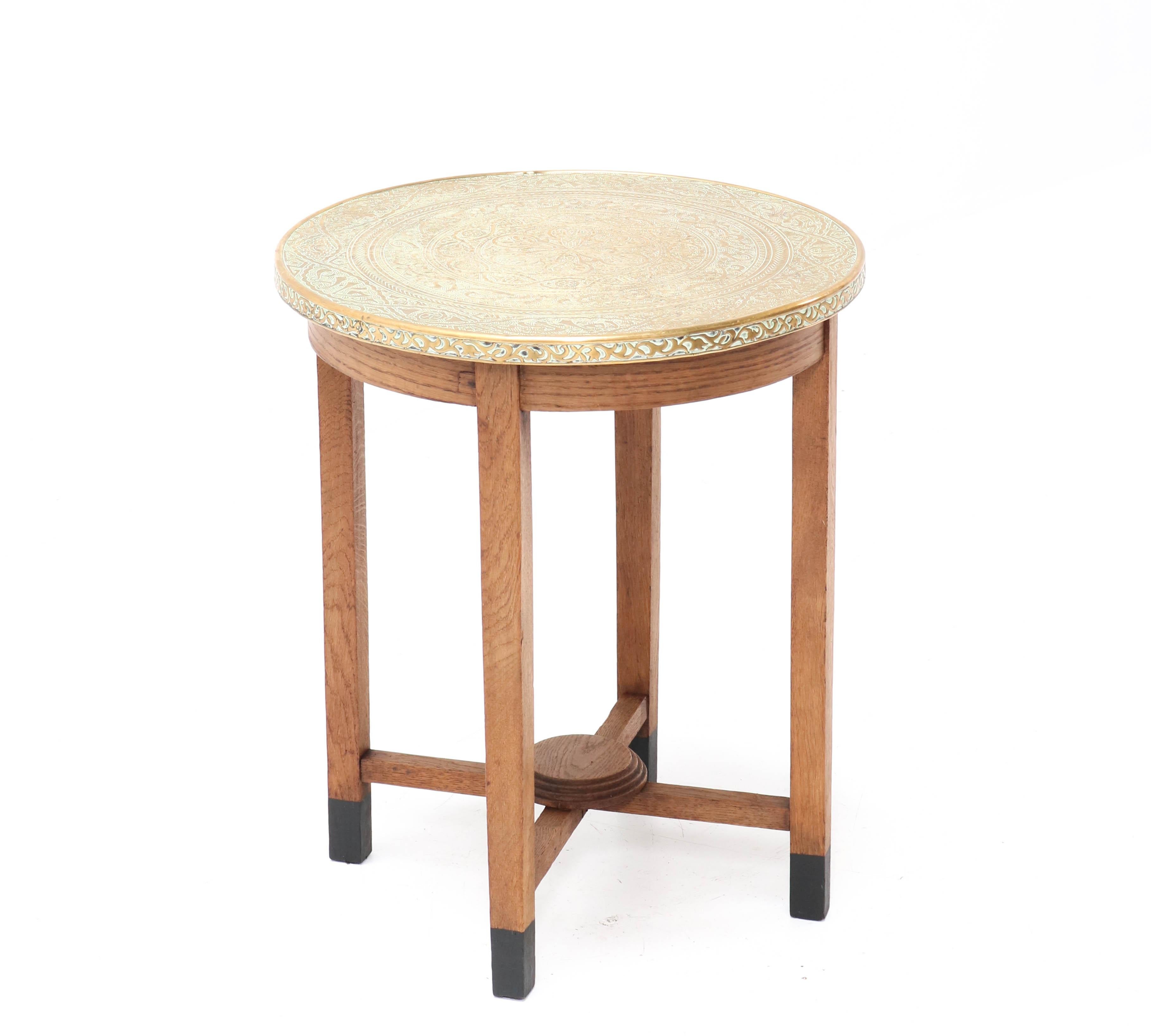 Wonderful Art Deco occasional table.
Striking Dutch design from the 1920s.
Solid oak frame with original etched brass top.
In very good condition with minor wear consistent with age and use,
preserving a beautiful patina.
