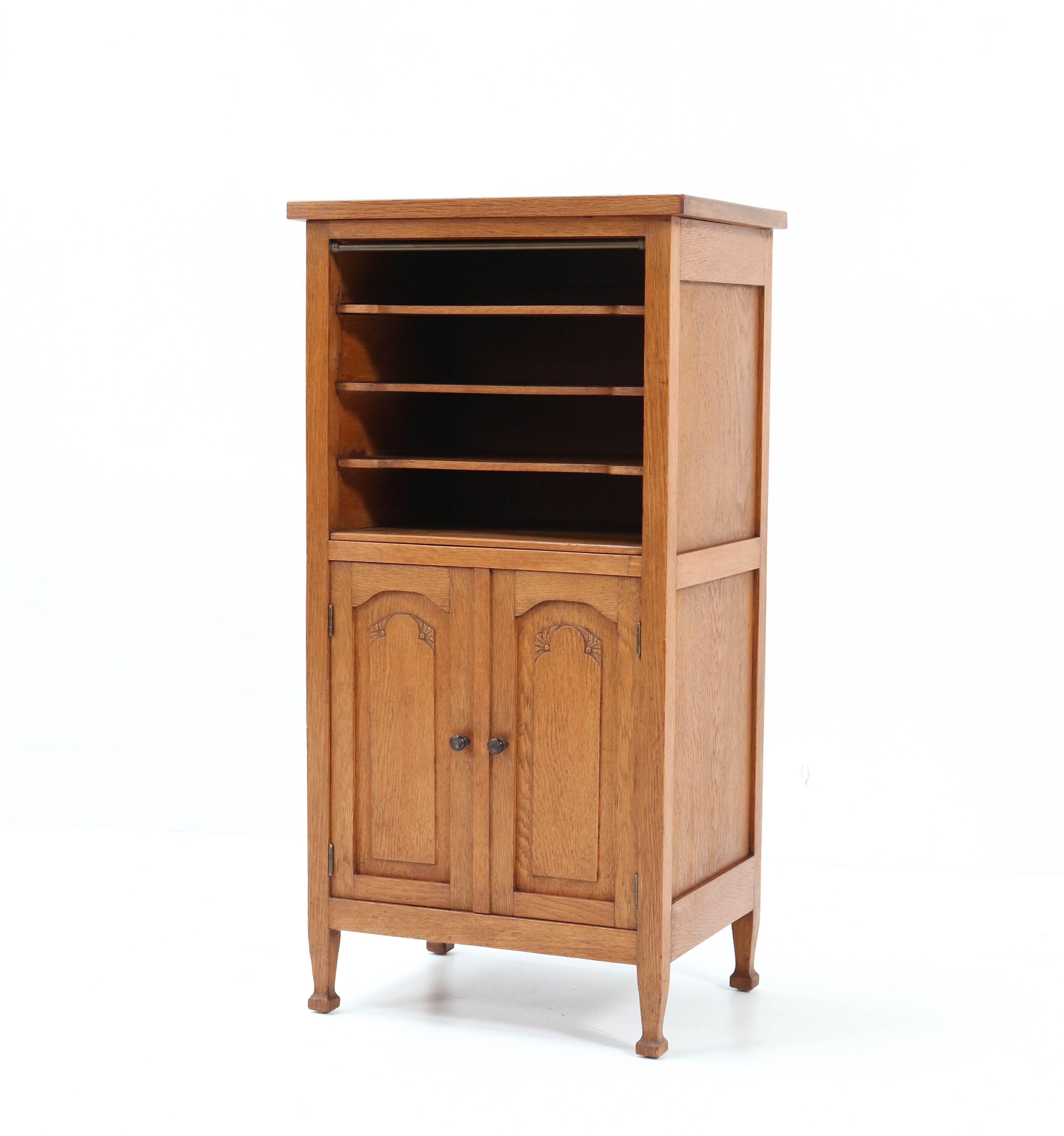 Wonderful and rare Art Nouveau Arts & Crafts cabinet.
Striking Dutch design from the 1900s.
Solid oak with solid Macassar ebony knobs on the doors.
Rare because of its size and quality!
In very good condition with a beautiful patina.