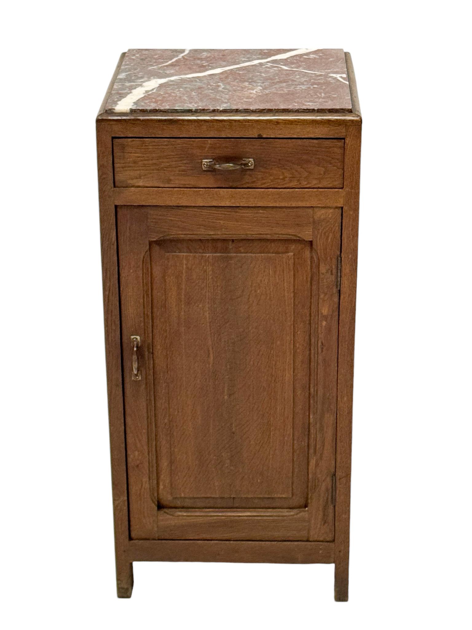 Stunning and elegant Art Nouveau nightstand or bedside table.
Striking Dutch design from the 1900s.
Solid oak base with original patinated brass handles on drawer and door.
Original multi-colored marble top.
This wonderful Art Nouveau nightstand or