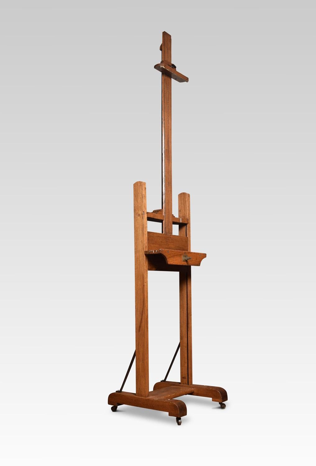 Oak artist’s adjustable studio easel raised up on trestle base terminating in casters.
Dimensions
Height 66 Inches adjustable to 99.5 Inches
Width 21 Inches
Depth 22 Inches