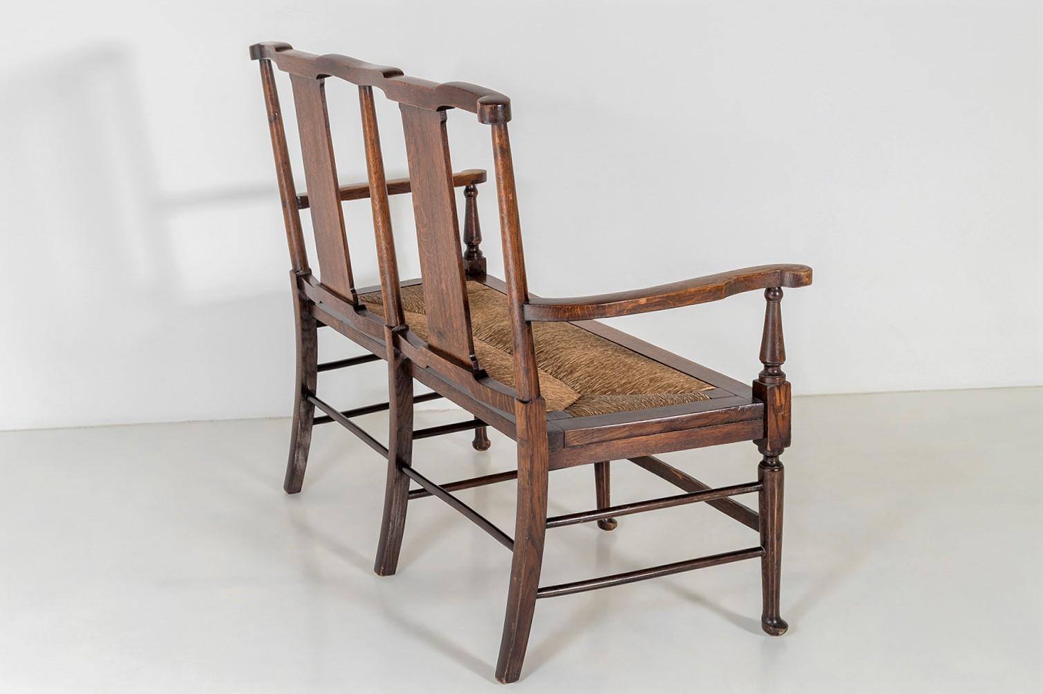 English Oak Arts & Craft Bench with Rush Seat in the manner of William Morris & Co