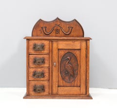 Oak Arts & Crafts Wall Cabinet with Hand-Carved Stork, 1900s