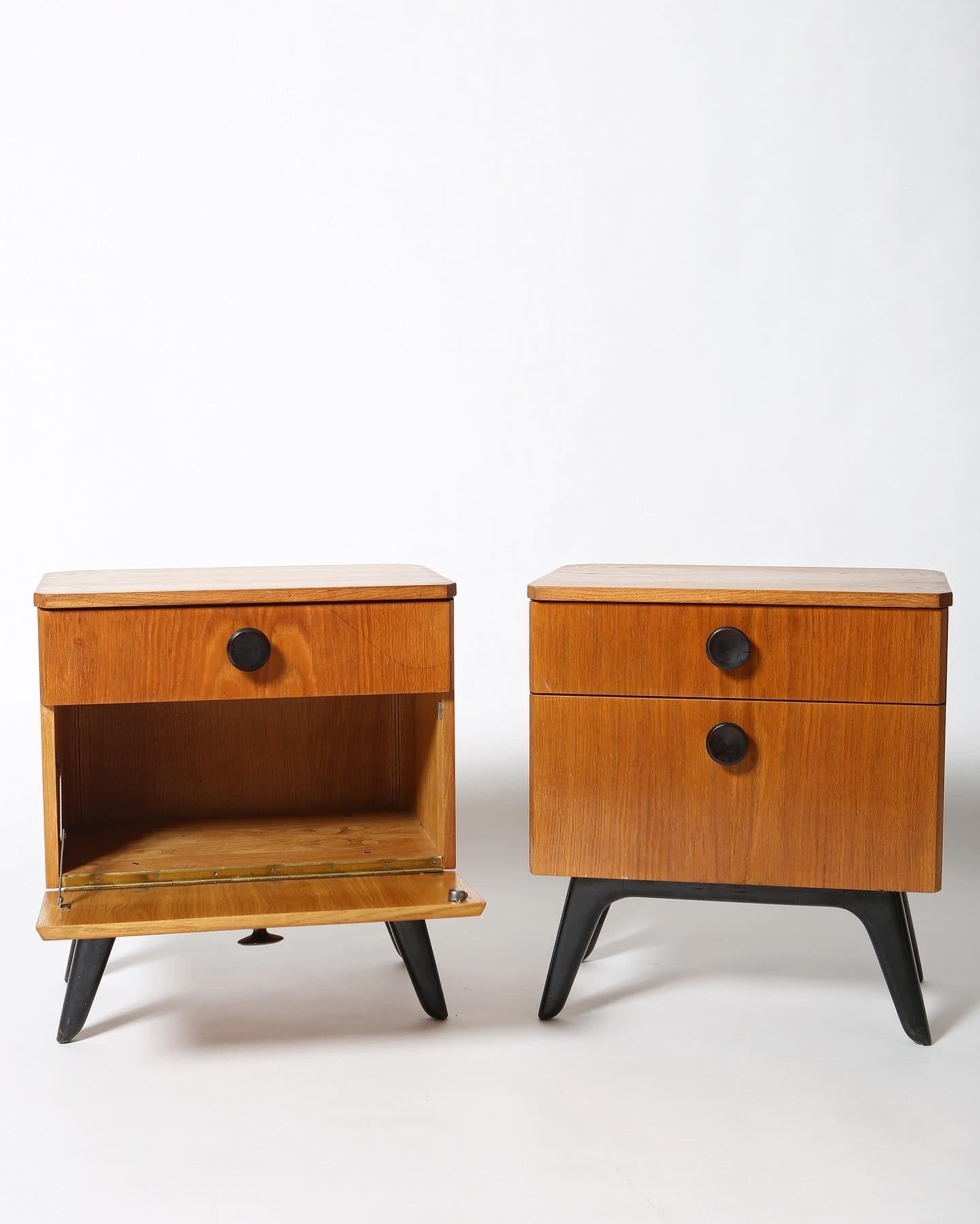 Charming pair of modernist solid oak side tables by Jindrich Halabala. Czech Republic circa 1940s. Each with a top drawer and drop cabinet for storage. Rounded back corners and the wonderful patina of 70 years in use. Excellent condition.