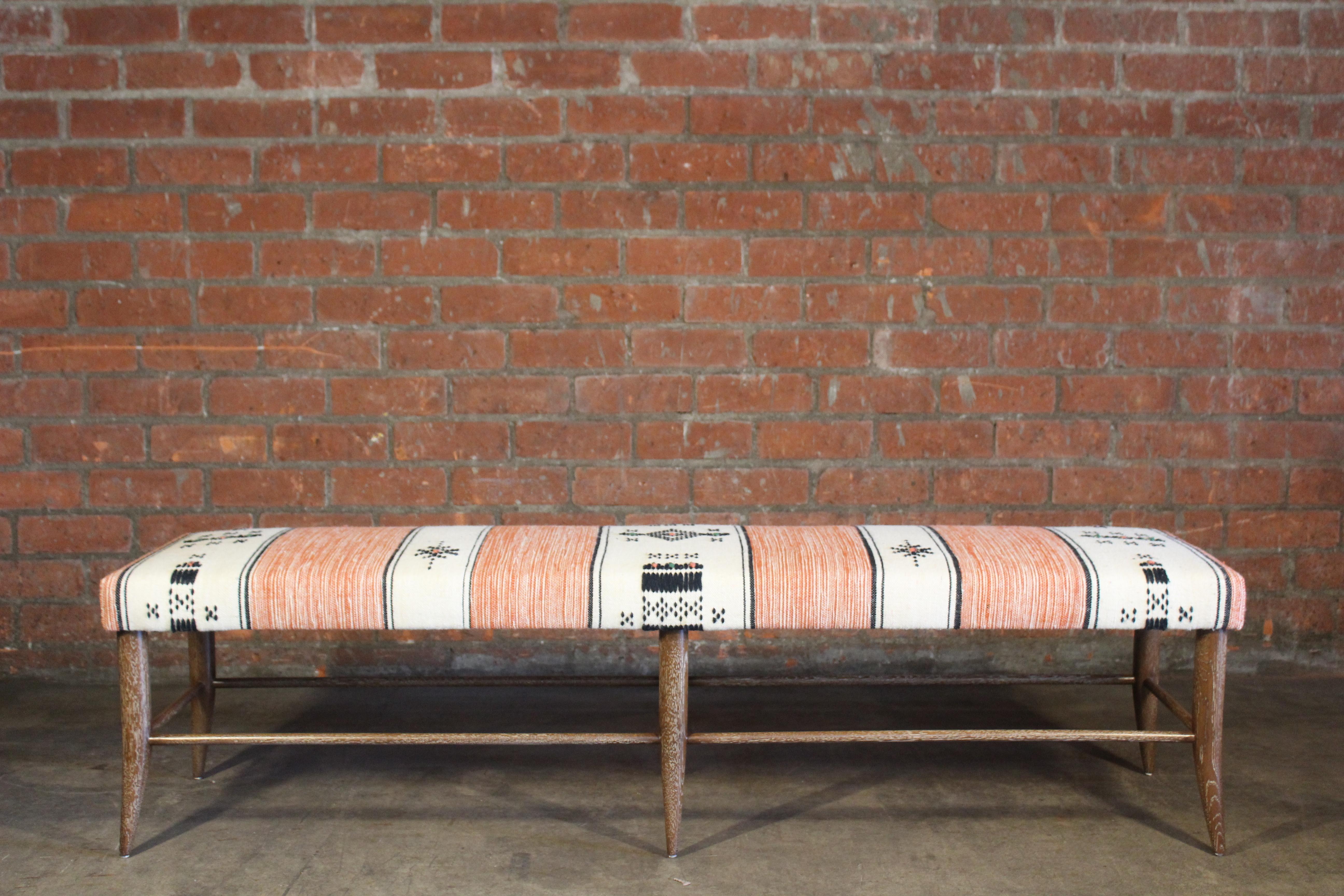 A solid oak handcrafted bench in dark cerused finish- handmade here in Los Angeles. Upholstered in a vintage orange and off-white Moroccan wool textile from the 1970s. In overall excellent condition.