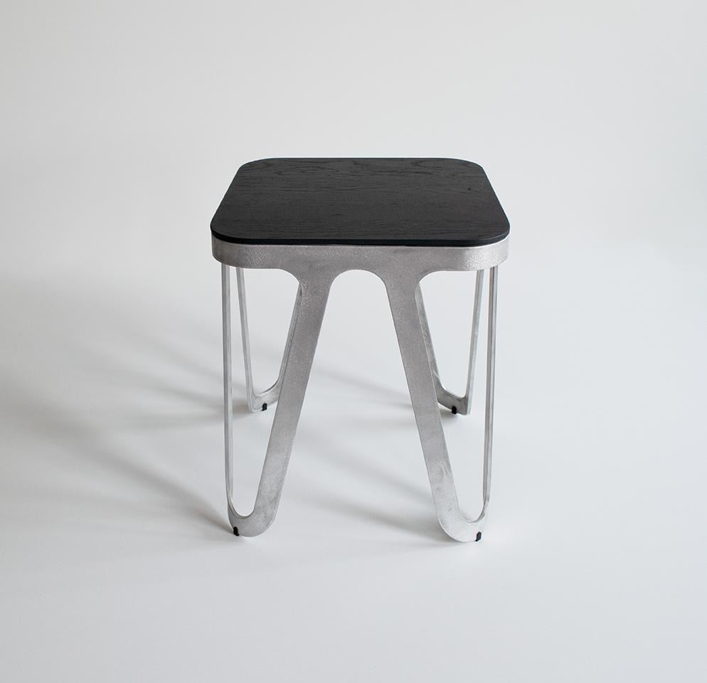 Oak black loop stool by Sebastian Scherer
Dimensions: D38 x W38 x H45 cm
Material: Aluminium, solid wood, oak
Weight: 4.2 kg
Also available in aluminium, loop stool wood: solid wood (matt lacquered): black and white stained ash / natural oak /