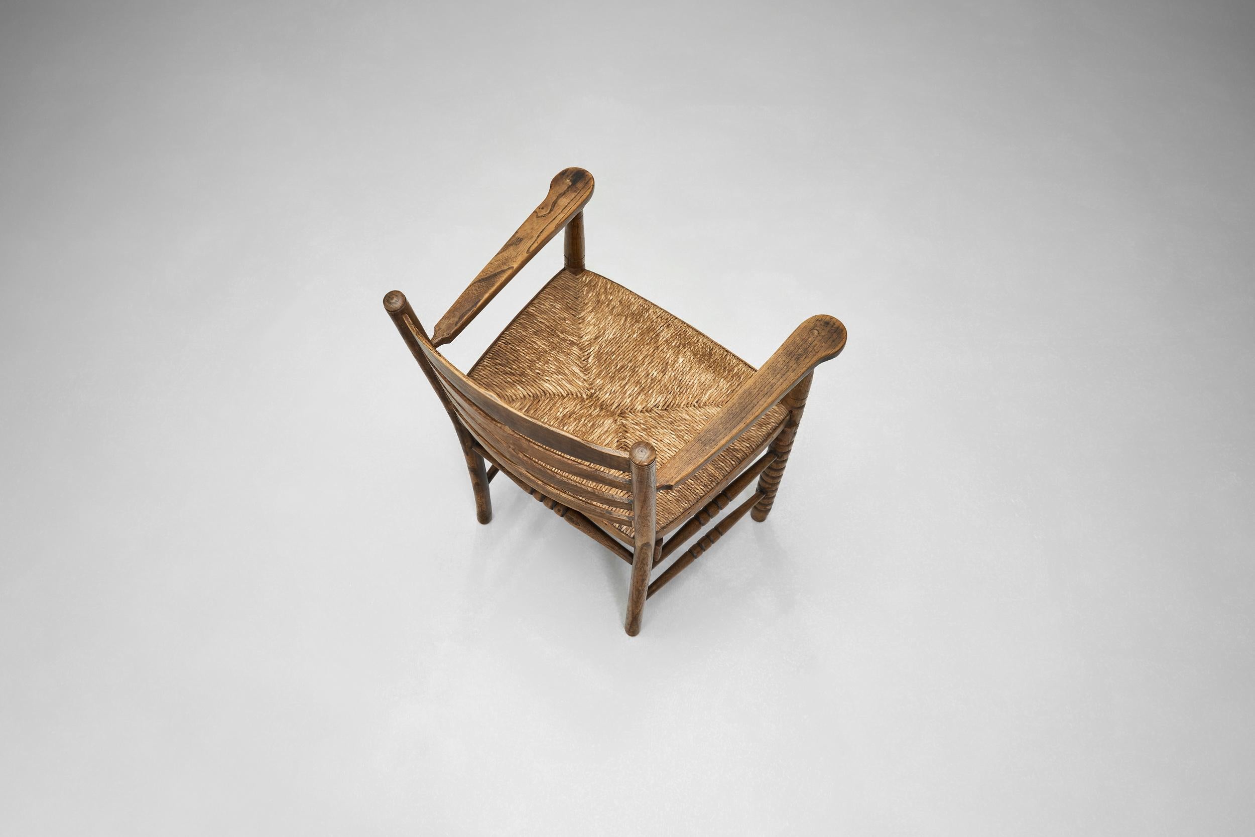 Quercia Poltrona in Oak con seduta in vimini, Paesi Bassi, anni '30 in vendita