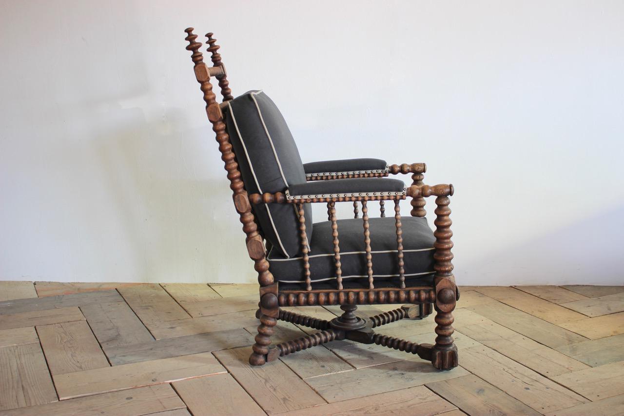 A great size, late 19th century oak bobbin turned library armchair, having been reupholstered by us in a 100% wool.
Measurements: 54 cm high (floor to seat).
  