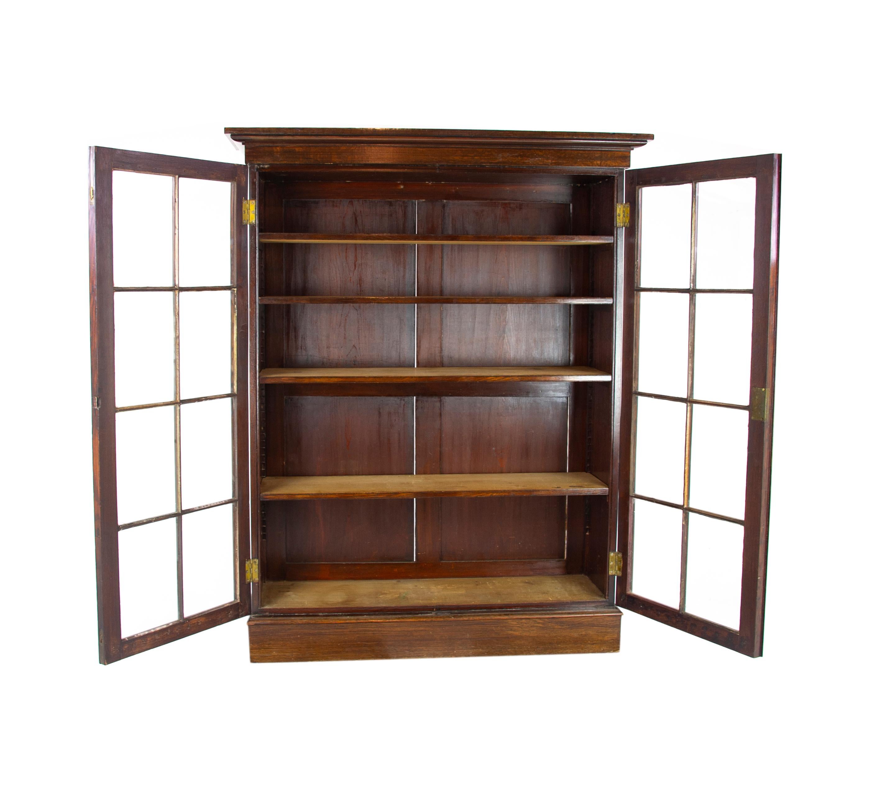 Oak bookcase, Arts & Crafts bookcase, carved oak bookcase, Scotland 1915, antique furniture, B1190.

Scotland, 1915
Solid tiger oak construction
Original finish
Overhang cornice above
Pair of original glass doors with eight panels