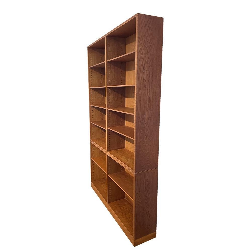 Bookcase consisting of two modules, in oak with mid-century modern Scandinavian design, designed by Børge Mogensen in the 1950s and produced by FDB Møbler in the 1960s. The beautiful proportions and clean aesthetic make this piece of furniture