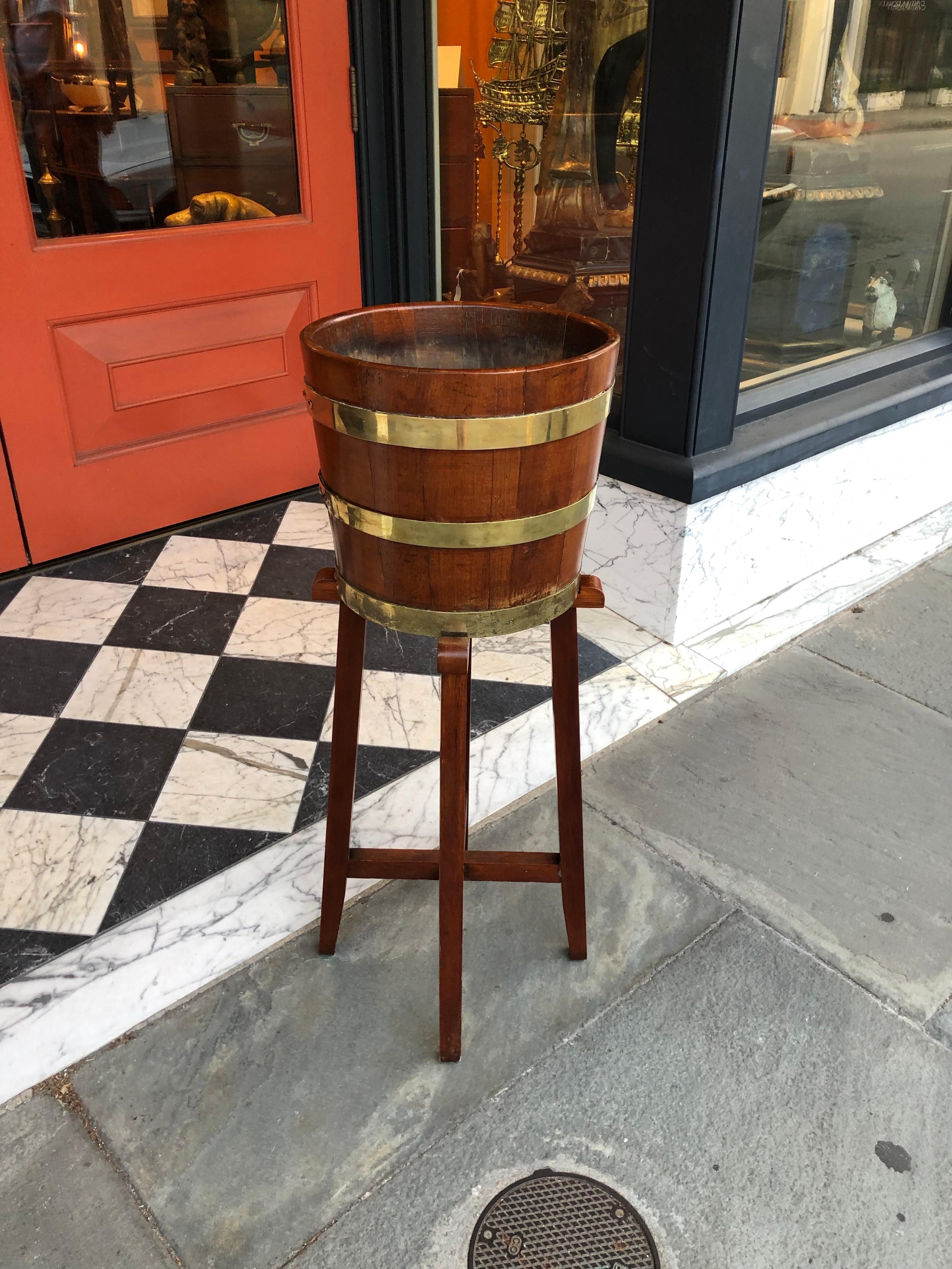 Oak brass bound English bucket on stand for planter or wine.
