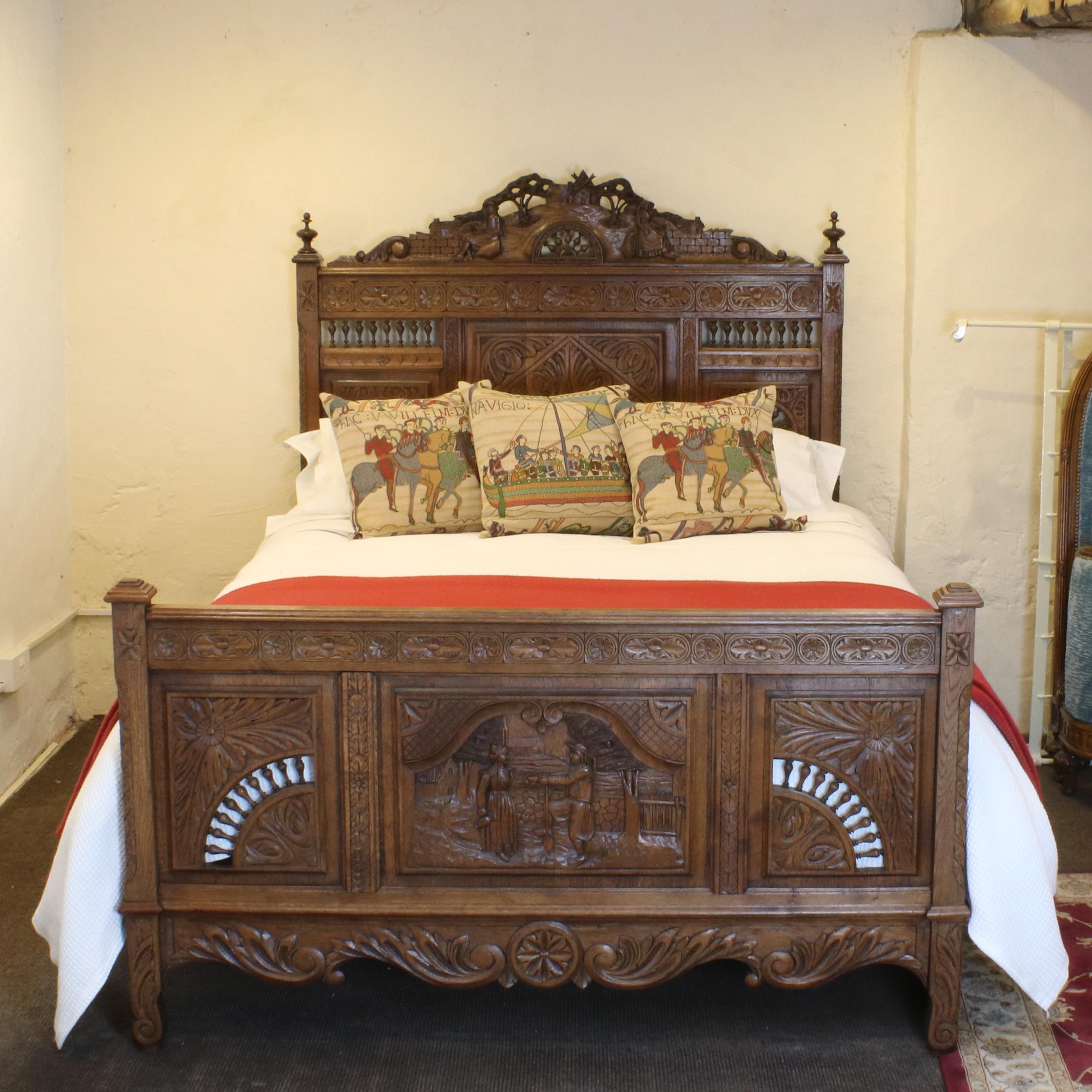 Superbly carved oak Breton bed depicting rustic scenes of peasant figures and typical 