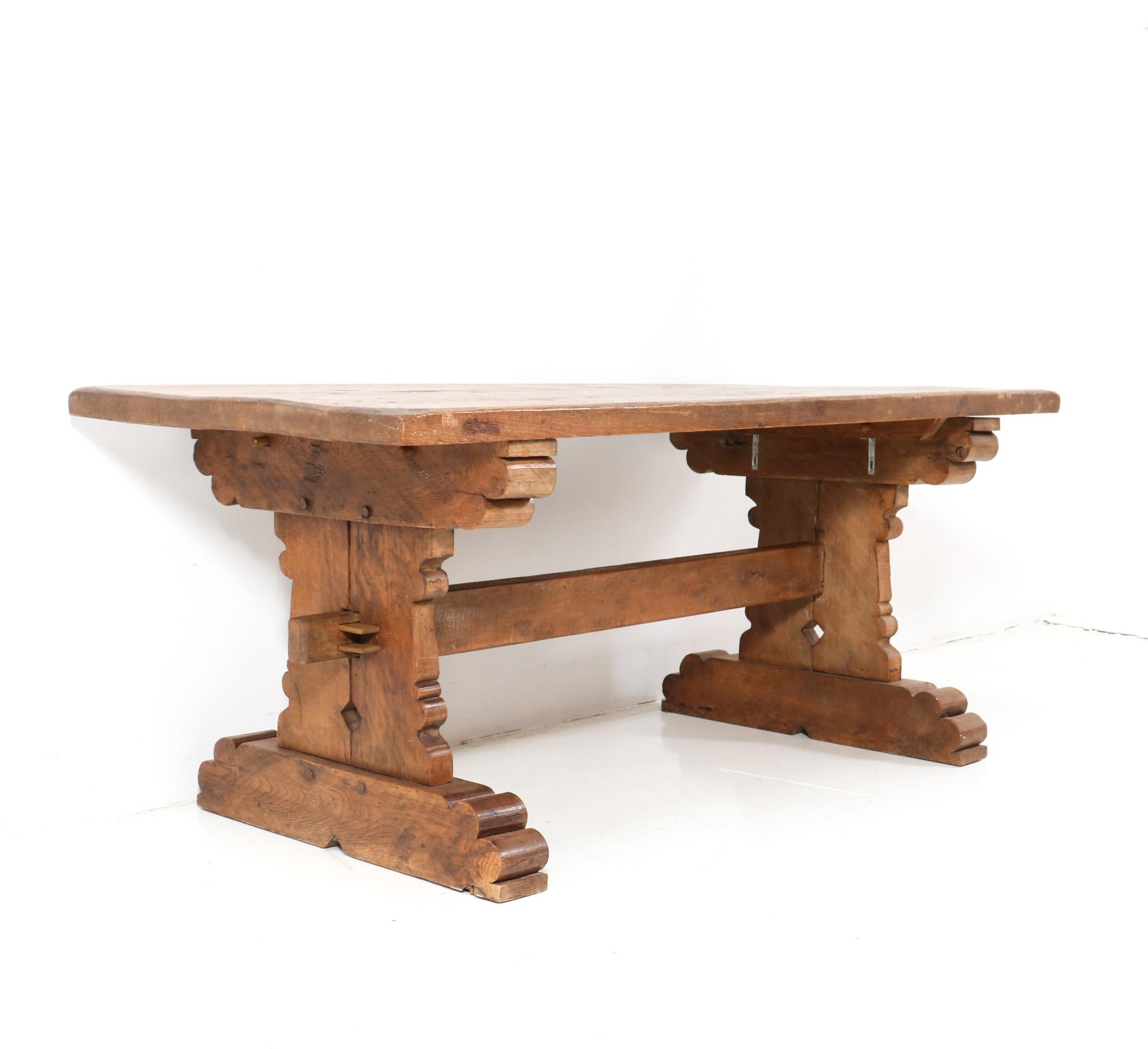 Stunning Brutalist dining room table or refectory table.
Striking Dutch design from the 1970s.
Solid oak base with original solid oak top.
This wonderful Brutalist dining room table or refectory table is in very good original condition with minor