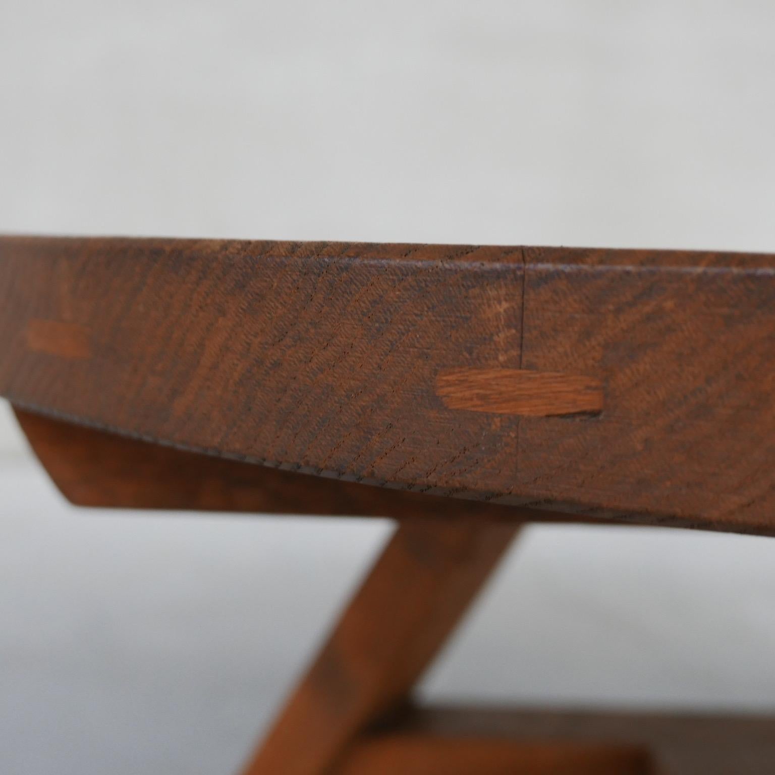 A thick chunky oak brutalist coffee table.

Belgium, c1970s.

Tripod legs.

Some darkness to the top. Wear commensurate with age but generally good condition.

Location: Belgium Gallery

Dimensions: 100 diameter x 50 height in