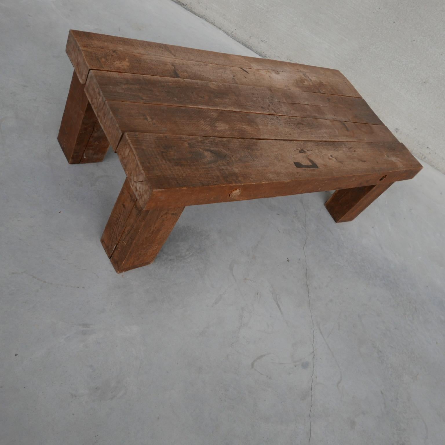 A chunky oak sleeper coffee table in the brutalist style. 

Belgium, c1970s. 

Some marks to the top commensurate with age but generally good condition and solid.

Dimensions: 58 D x 119 W x 37.5 H in cm. 

Delivery: POA, We can ship around