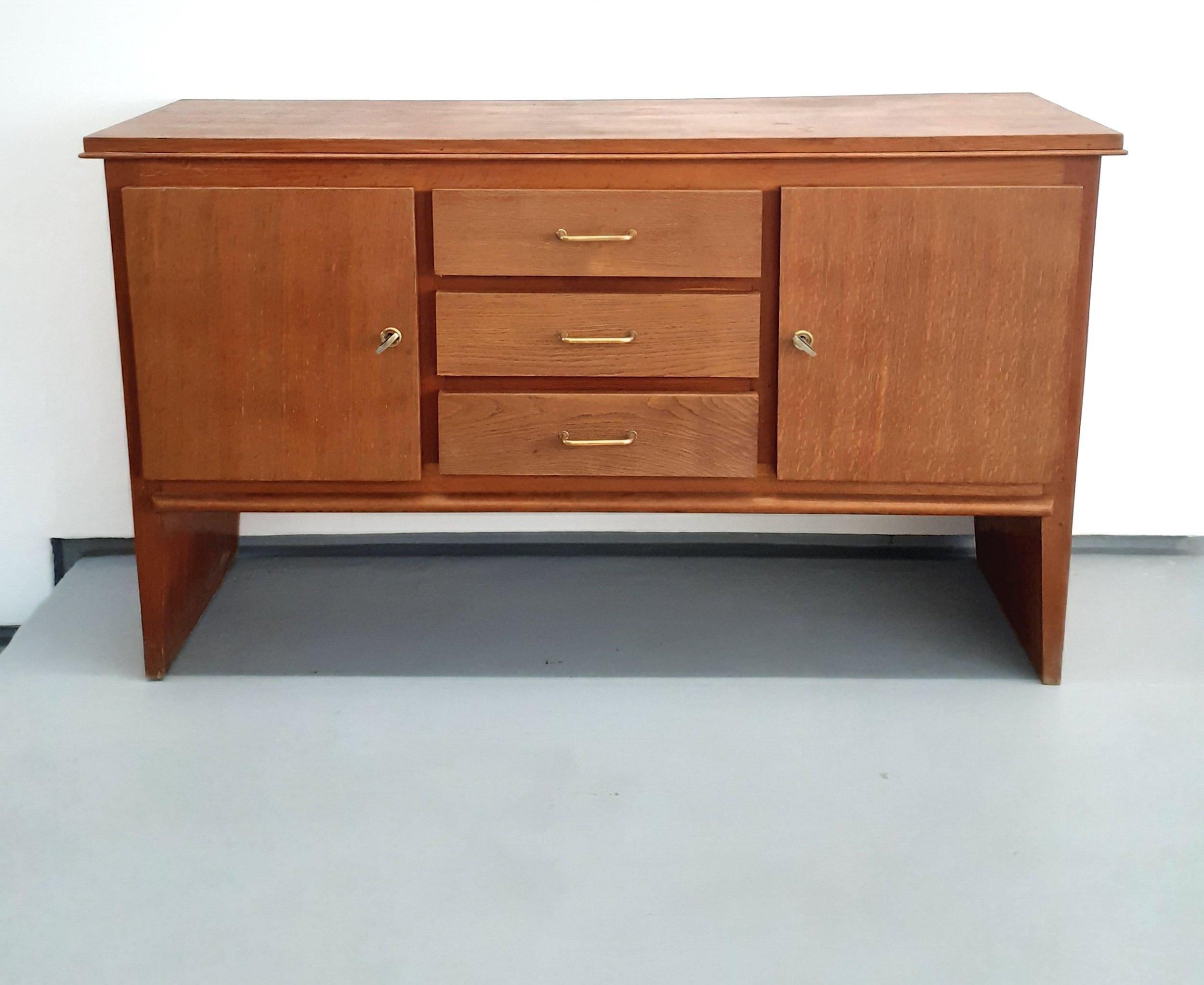 Oak buffet with 2 Doors and 3 Drawers by René Gabriel, 1940s

René Gabriel (1899 - 1950) is a precursor of French industrial design. He was one of the first to create, as early as the 1930s, economical mass-produced furniture combining aestheticism,