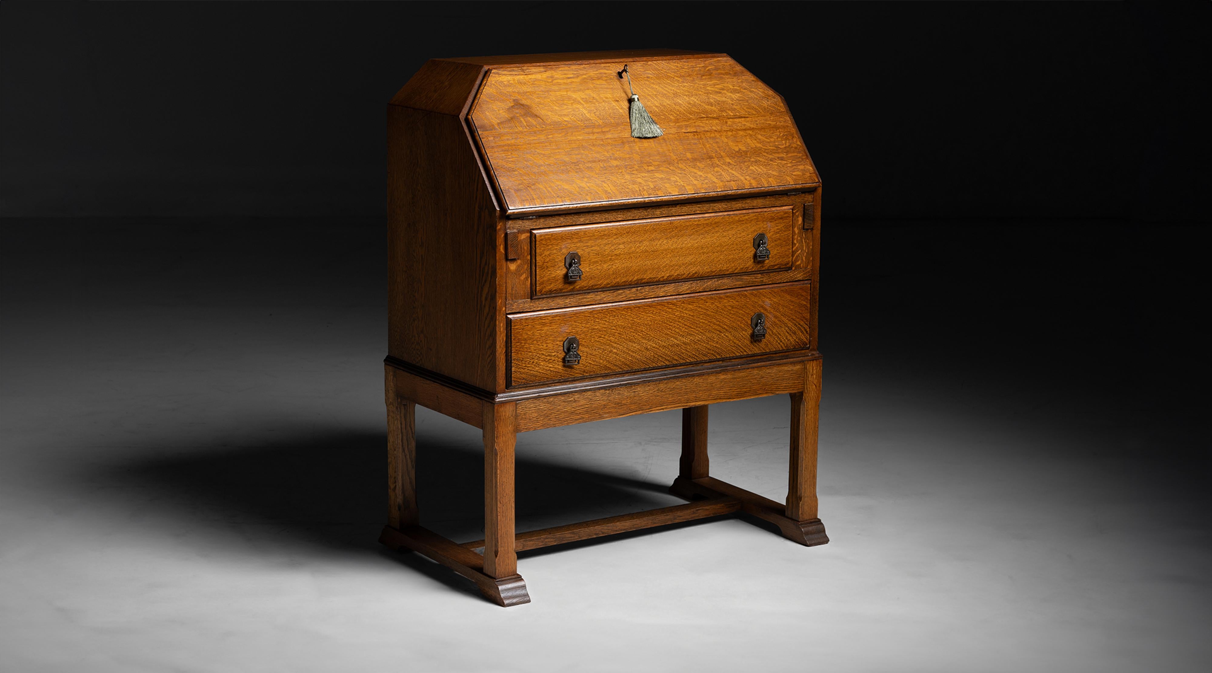 Oak Bureau / Desk
England circa 1930
Dropdown desk with leather surface and space for storage.
30