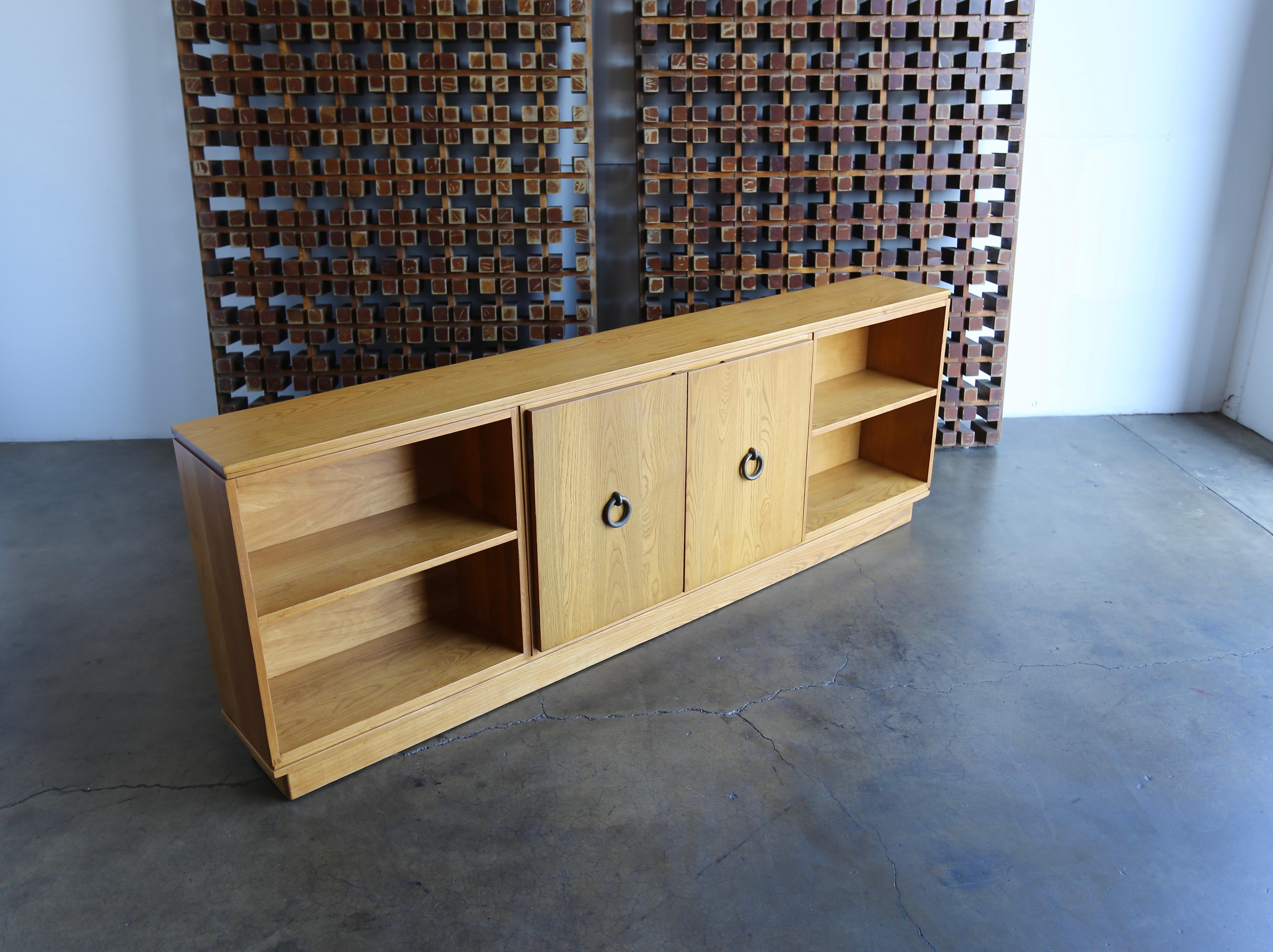 Oak cabinet / bookcase by Paul Laszlo, circa 1950. This piece has been professionally restored.