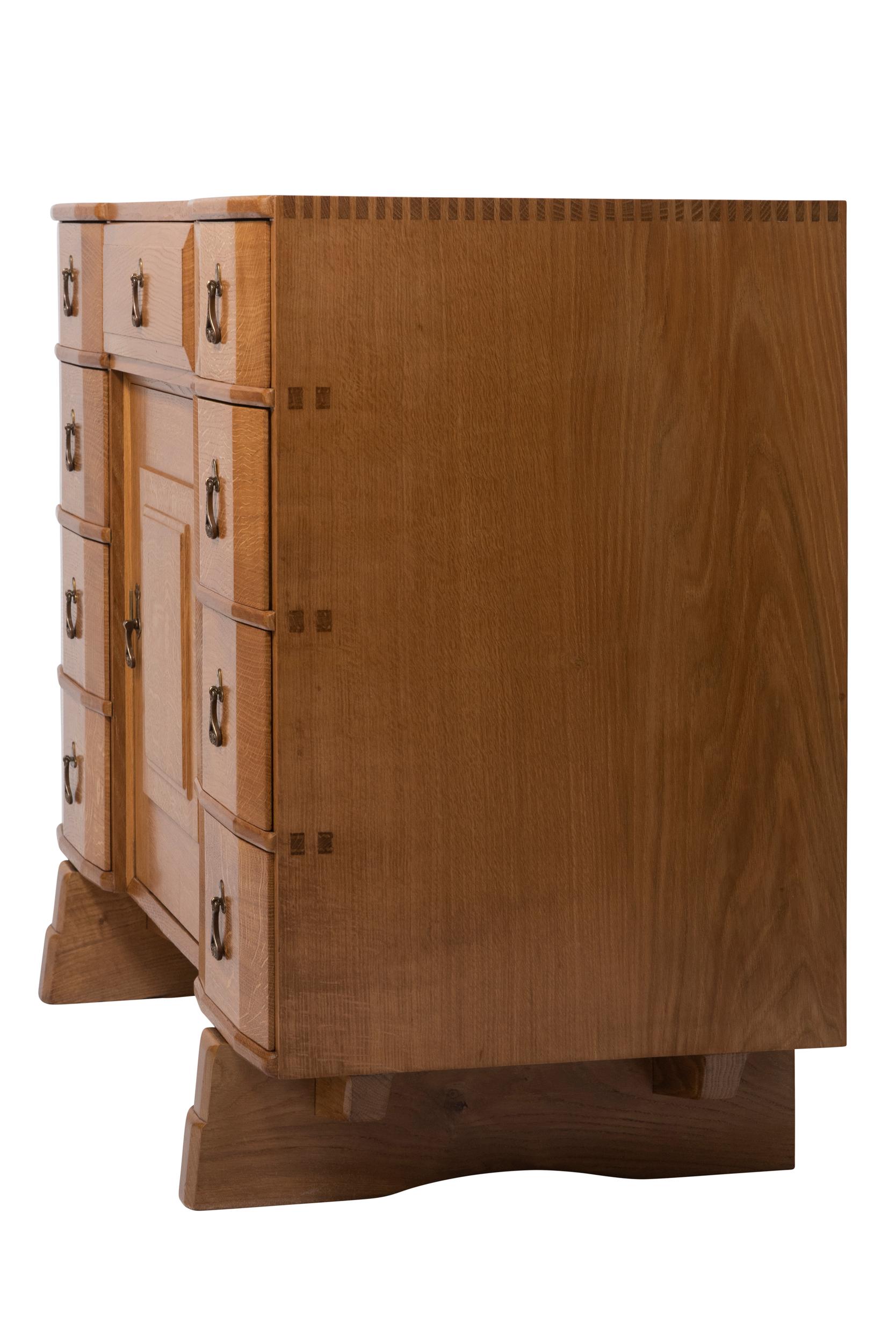 Arts and Crafts Oak Cabinet by Peter Waals with Wrought Iron Scroll Handles, England, circa 1930 For Sale