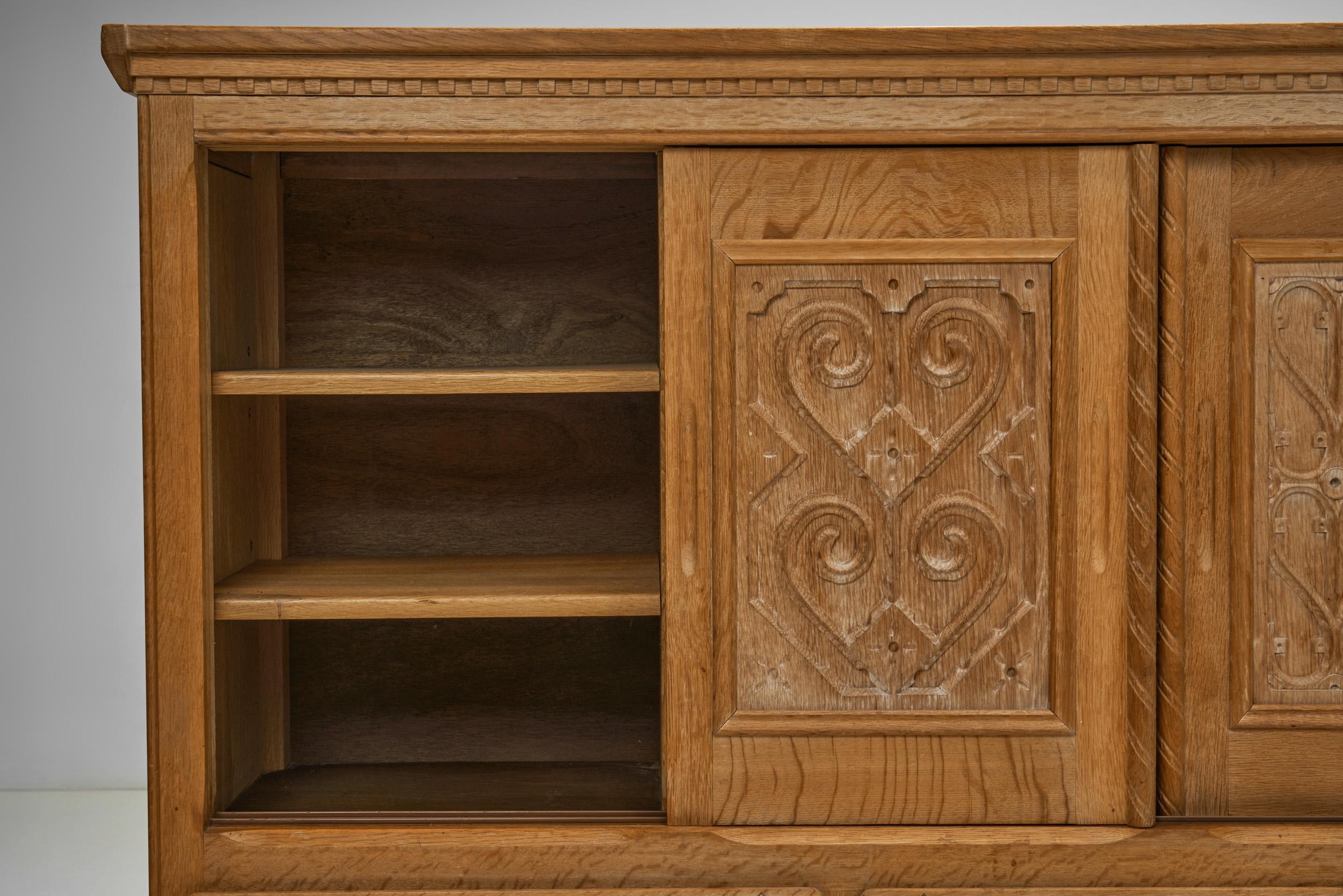 Oak Cabinet with Carved Motifs by Henning Kjærnulf, Denmark Mid 20th Century For Sale 4
